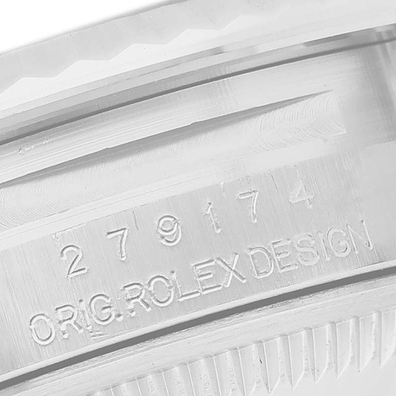 The image shows a close-up of the serial number engraving on the side of a Rolex Datejust 279174 Women's Stainless Steel White Dial watch case.