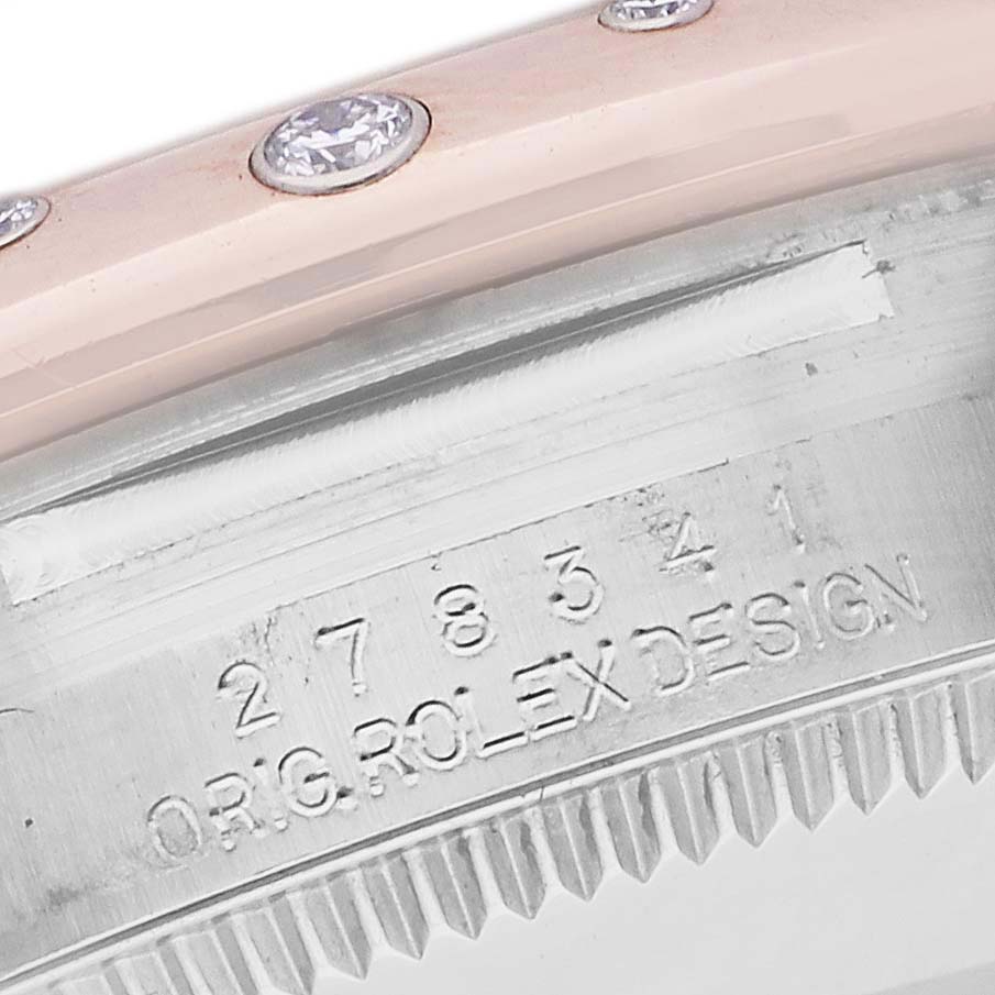 The image shows a close-up of the engraved side of a Rolex Datejust watch, featuring "ORIG ROLEX DESIGN" and a model number.