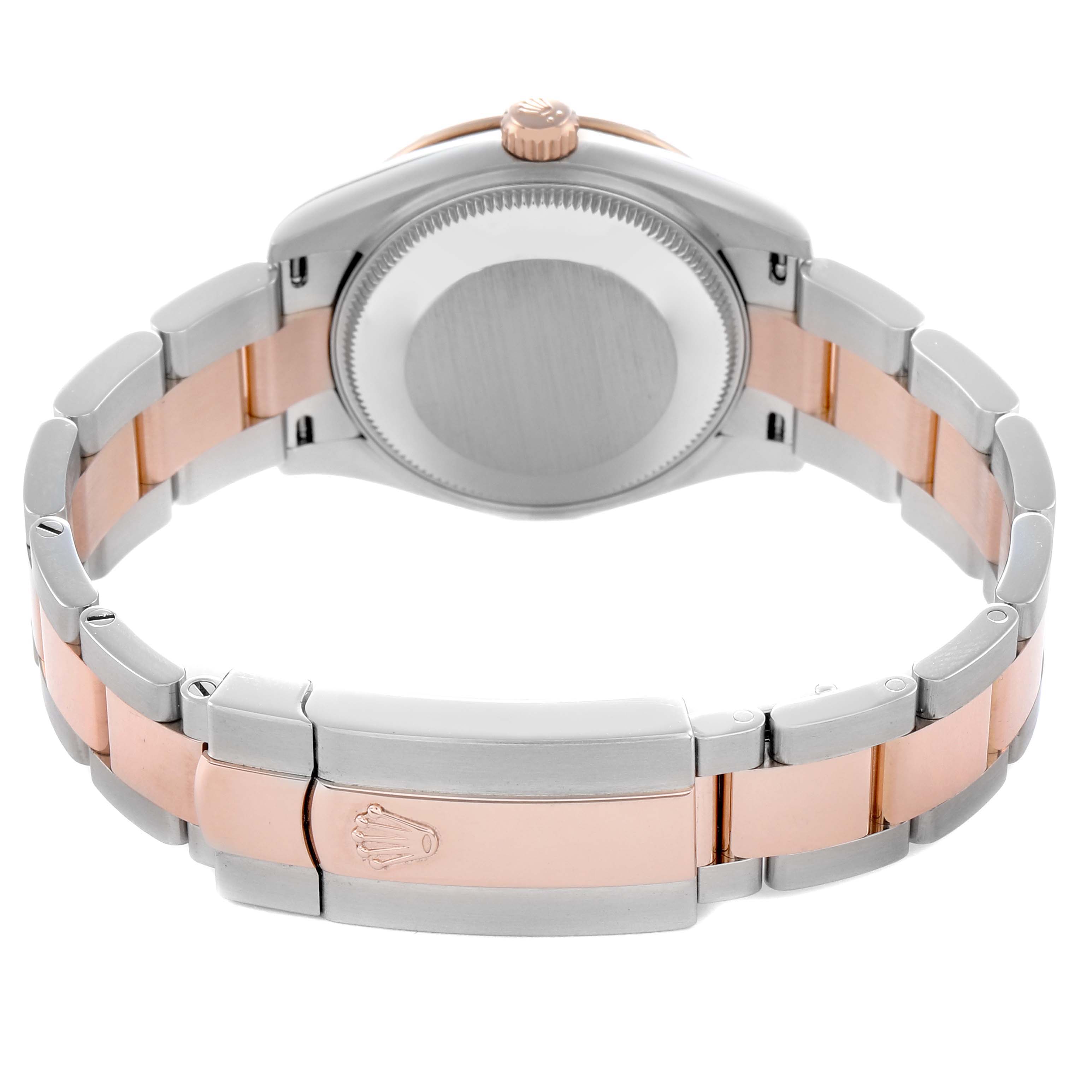 The image shows the back view of a Rolex Datejust, featuring the clasp, case back, and two-tone bracelet.