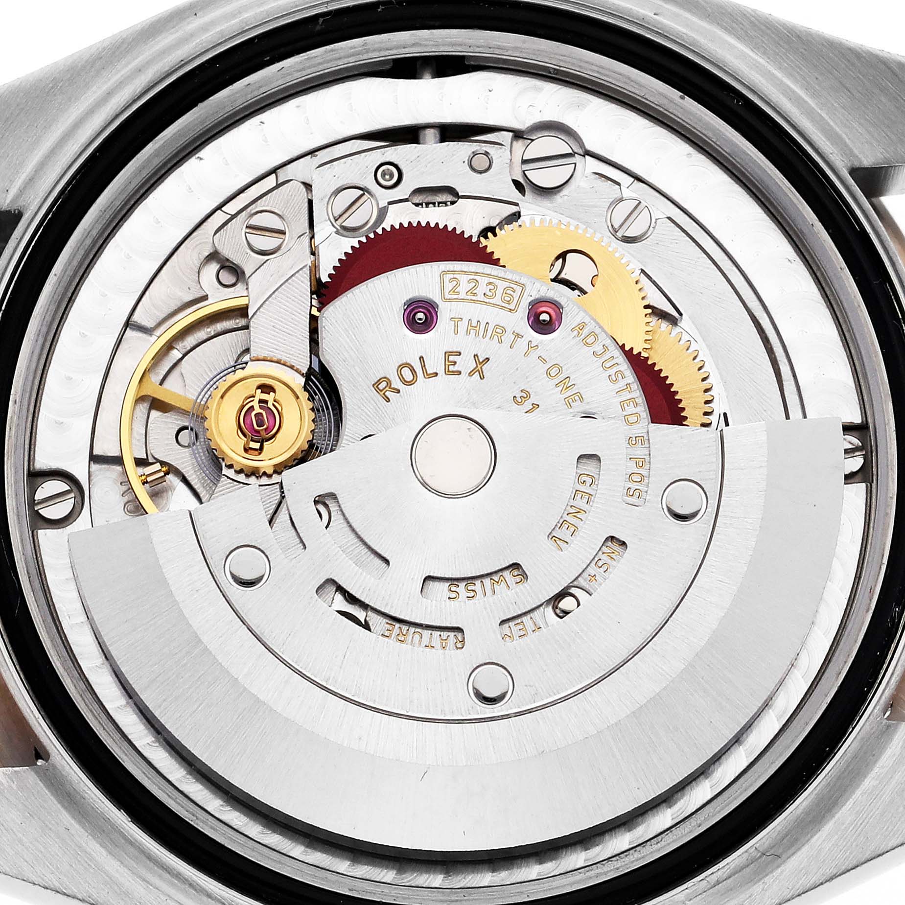 The image shows the back view of the Rolex Datejust watch, highlighting its intricate internal movement mechanism.