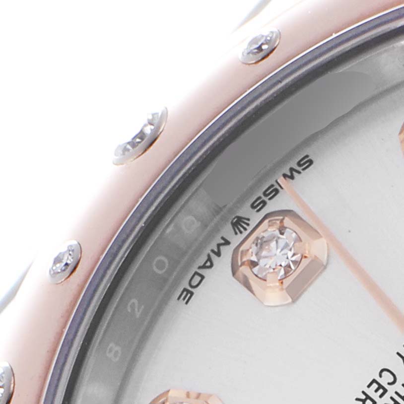 The image shows a close-up of the Rolex Datejust
s dial, focusing on a diamond marker and part of the bezel.