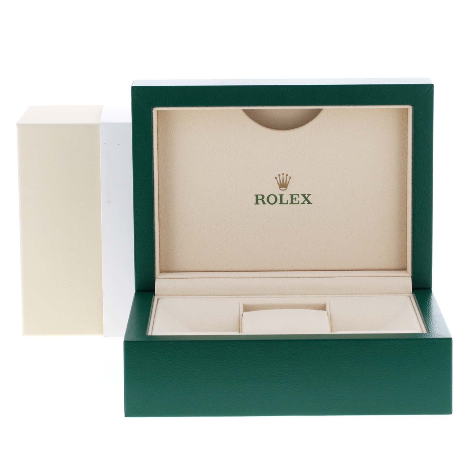 This image shows an open green and beige box for a Rolex Datejust 126200 Men
s Stainless Steel Blue Dial 126200 Men
s Stainless Steel Blue Dial watch, angled to reveal the interior compartments.