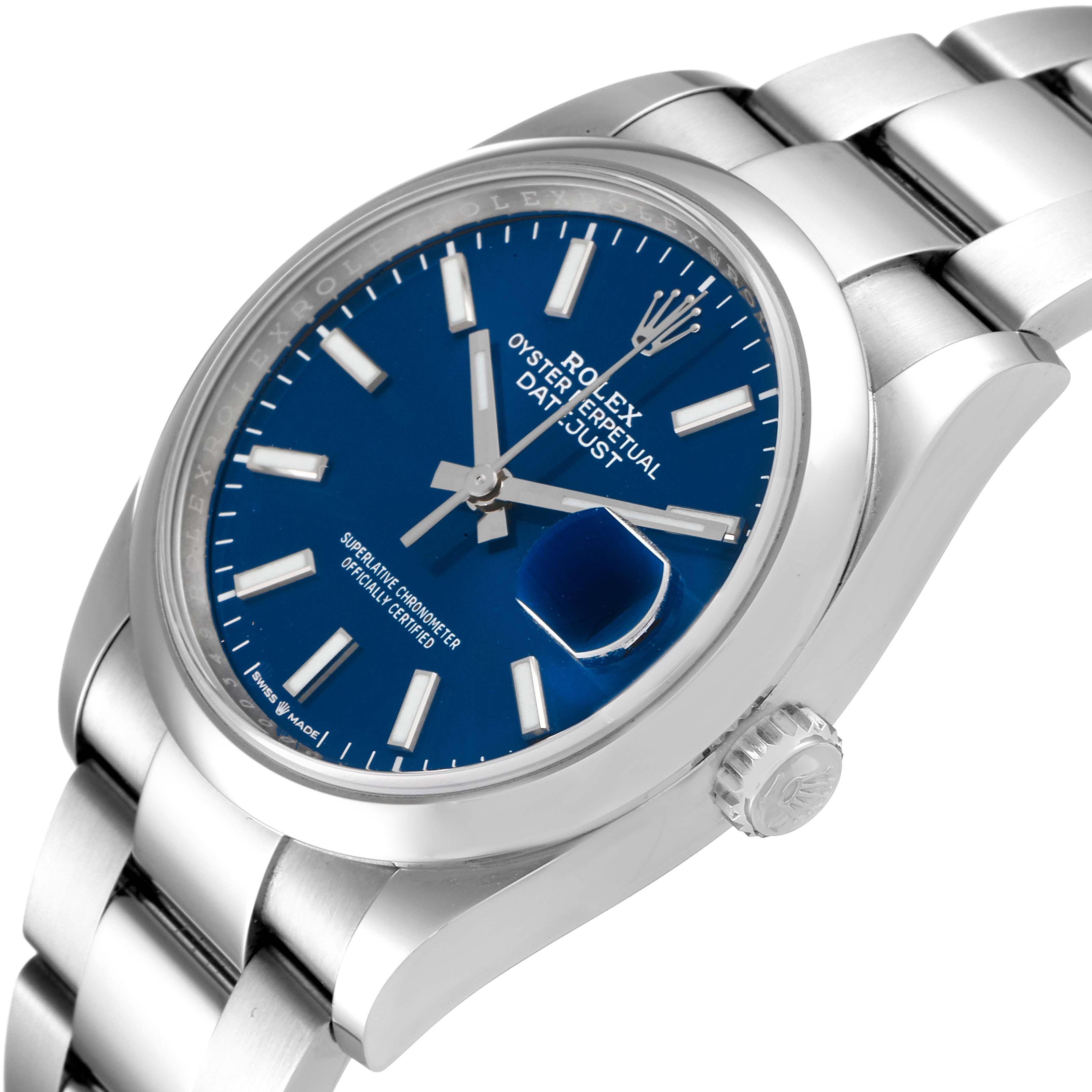 This image shows a Rolex Datejust 126200 Men
s Stainless Steel Blue Dial 126200 Men
s Stainless Steel Blue Dial watch angled from the front-left, highlighting the face, bezel, bracelet, and crown.