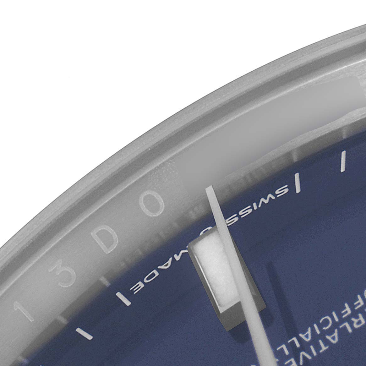 This image shows a close-up of the dial and hands of a Rolex Datejust 126200 Men
s Stainless Steel Blue Dial 126200 Men
s Stainless Steel Blue Dial watch, highlighting the "SWISS MADE" text.