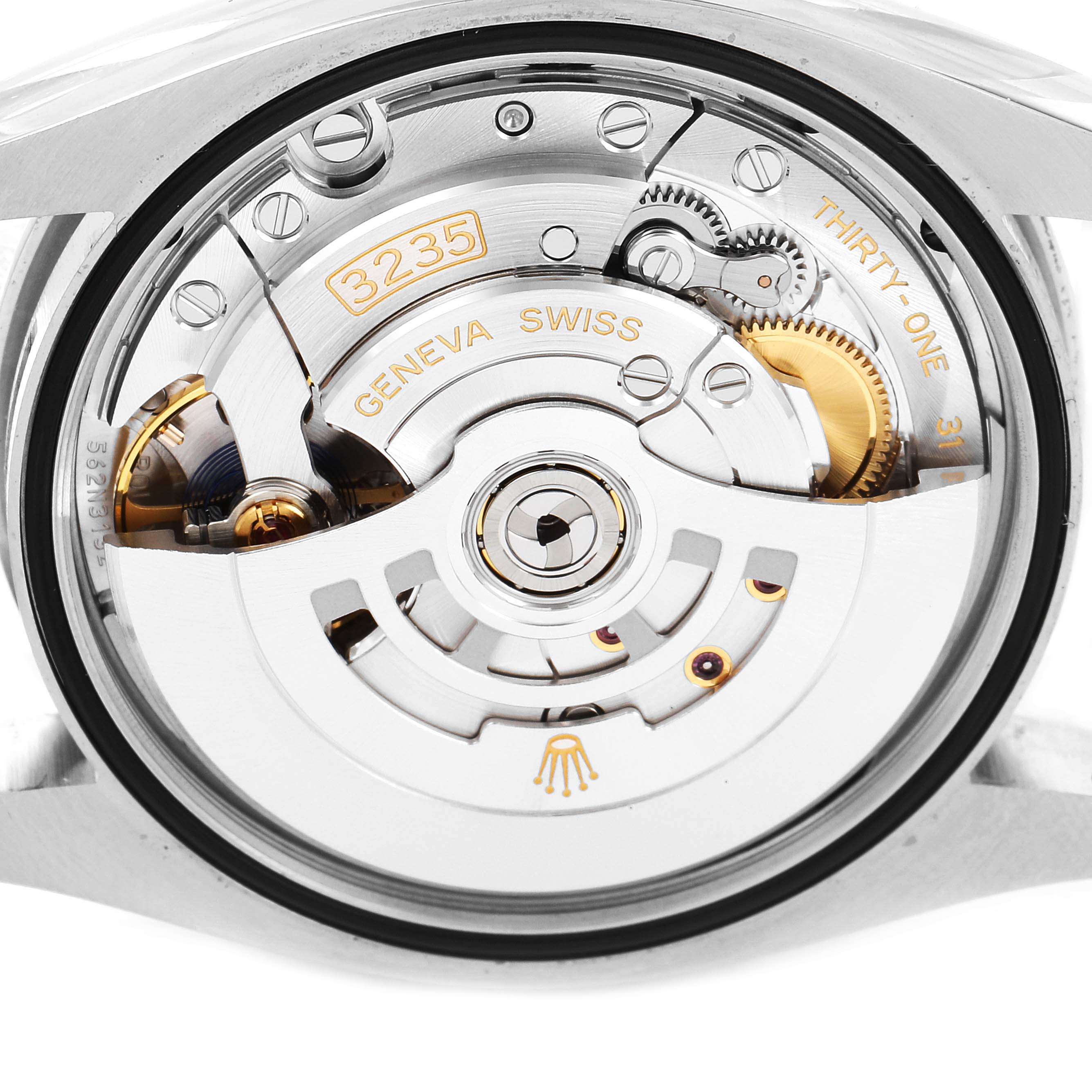 The image shows the movement and internal mechanism of a Rolex Datejust 126200 Men
s Stainless Steel Blue Dial 126200 Men
s Stainless Steel Blue Dial watch, viewed from the back.