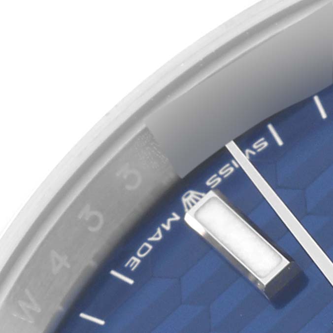 The close-up image shows the edge of the dial and a portion of the hour marker on a Rolex Datejust 126200 Men's Stainless Steel Blue Dial 126200 Men's Stainless Steel Blue Dial watch.