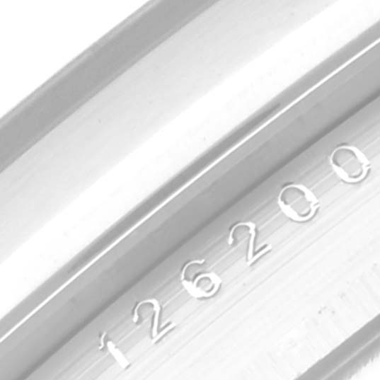 The image shows a close-up of the case or bezel with the reference number "126200" of a Rolex Datejust 126200 Men's Stainless Steel Blue Dial 126200 Men's Stainless Steel Blue Dial watch.