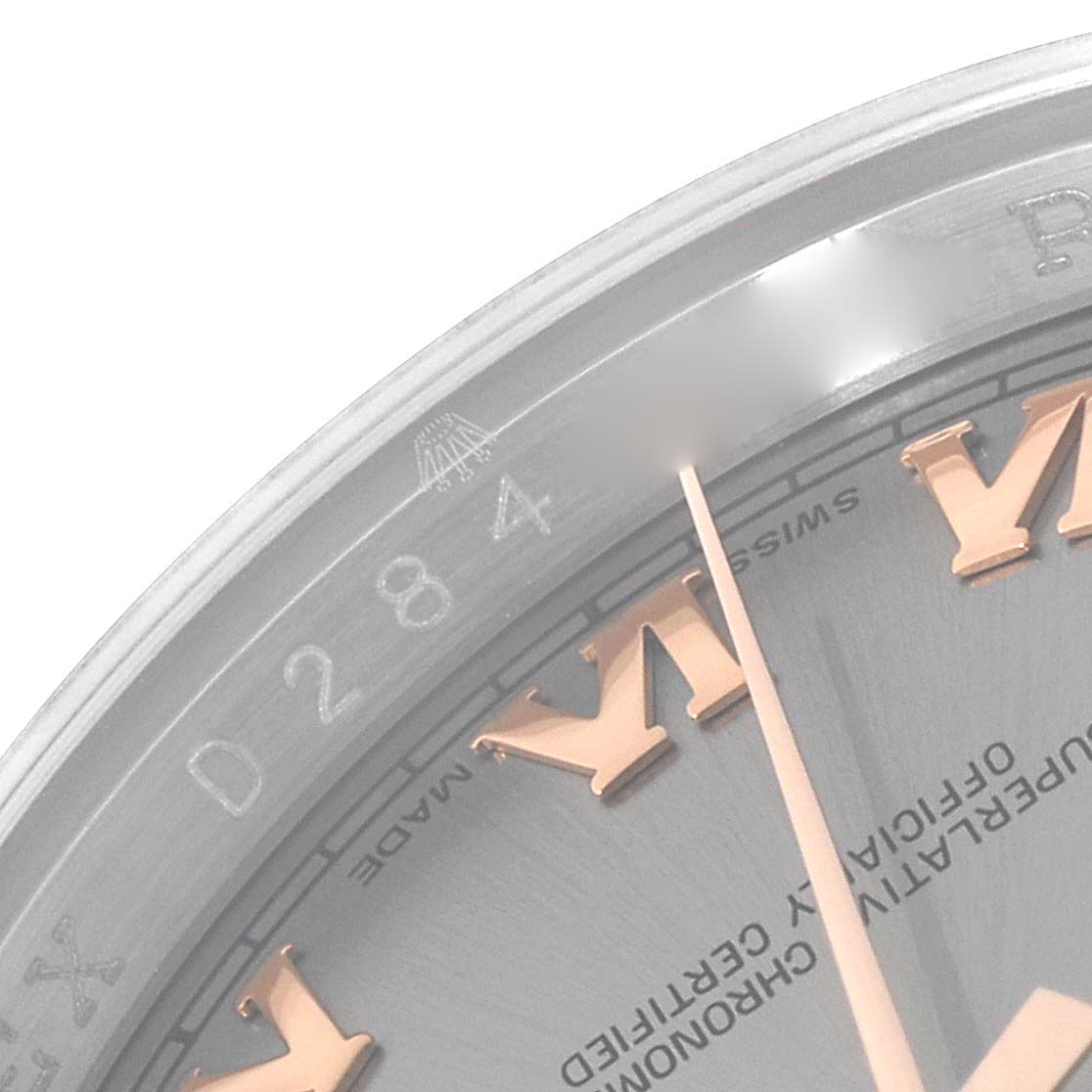 The image shows a close-up of the dial and bezel of a Rolex Datejust 116231 Men's Steel and Gold (two tone) Grey Dial 116231 Men's Steel and Gold (two tone) Grey Dial watch featuring Roman numerals and part of the serial number.