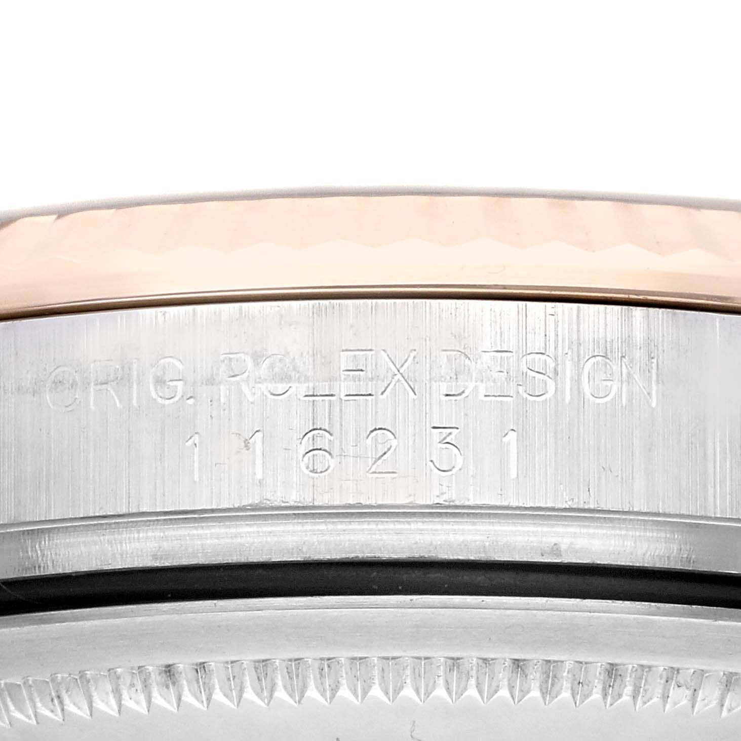 This close-up image depicts the side of the bezel and part of the case back, showing the model number of the Rolex Datejust 116231 Men's Steel and Gold (two tone) Grey Dial 116231 Men's Steel and Gold (two tone) Grey Dial.