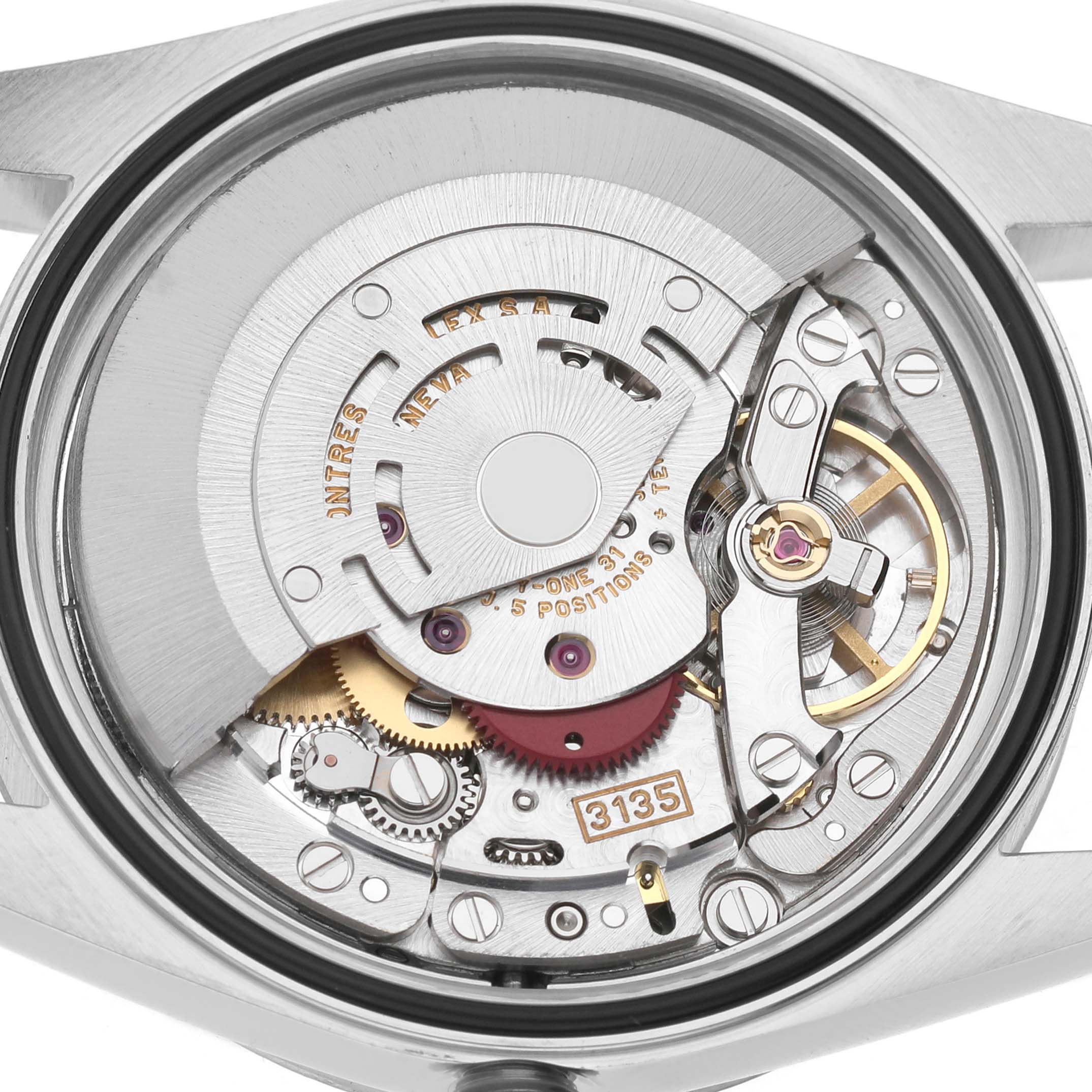 The image shows a close-up view of the Rolex Datejust 16234 Men's Stainless Steel Blue Dial movement, highlighting the rotor and intricate gears.