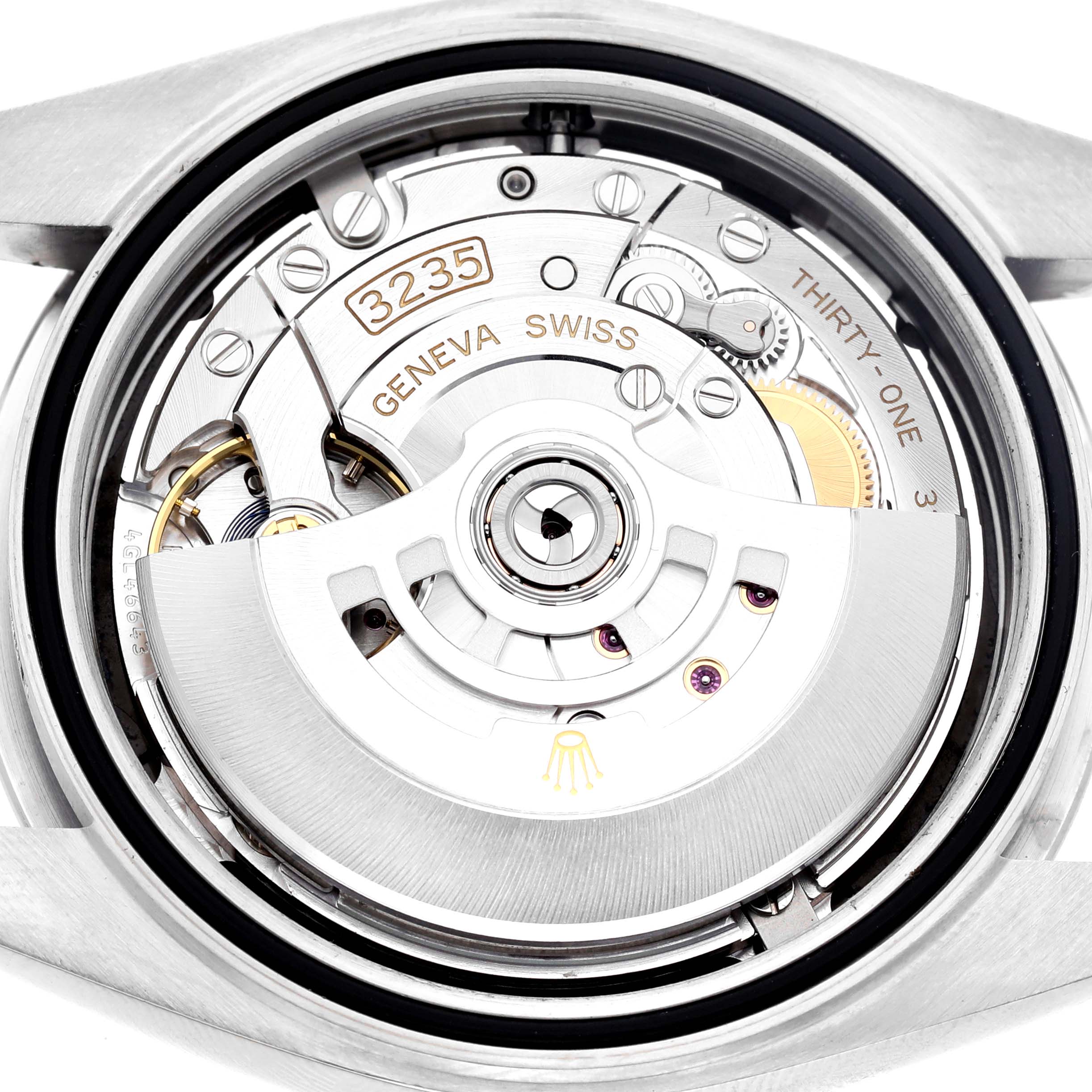 The image shows the movement of a Rolex Datejust 41 126300 Men's Stainless Steel Black Dial, viewed from the back, highlighting the rotor and intricate mechanical components.