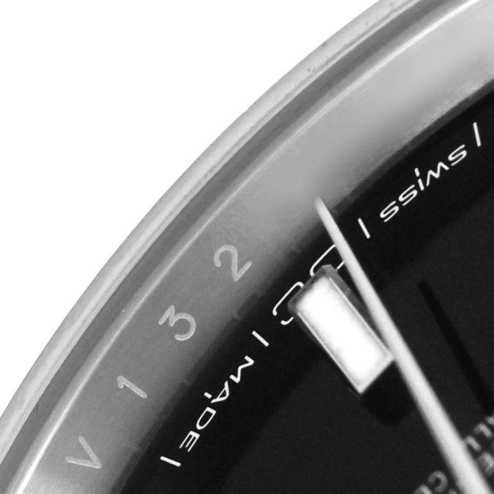 The image shows a close-up of the edge and dial of a Rolex Datejust 41 126300 Men's Stainless Steel Black Dial, highlighting the minute markers and part of the hand.