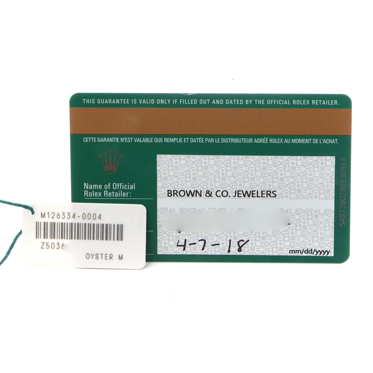 The image shows a Rolex Datejust 41 126334 Men
s Stainless Steel Silver Dial 126334 Men
s Stainless Steel Silver Dial warranty card and a tag with model details.