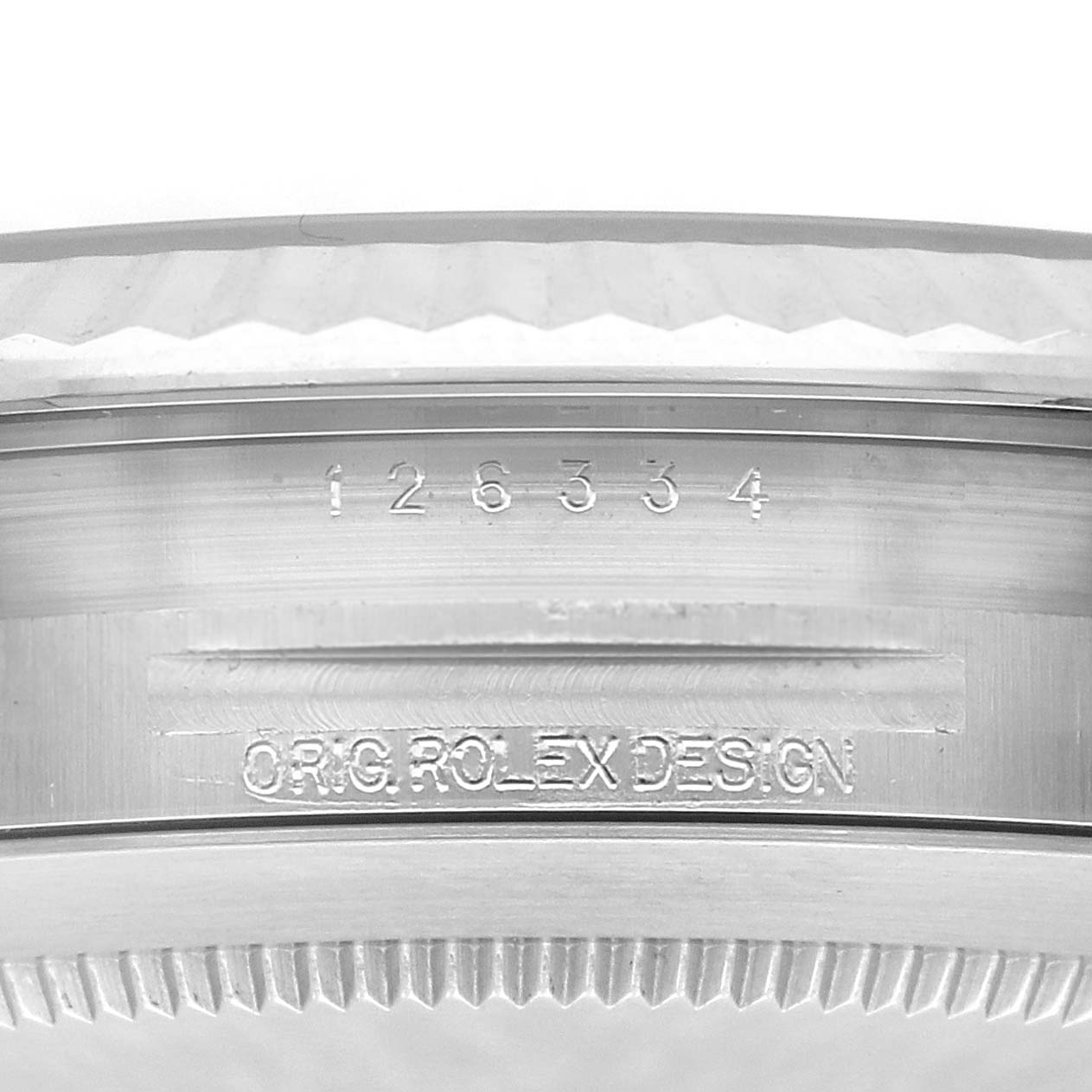 The image shows a close-up of the edge and engraving of a Rolex Datejust 41 126334 Men
s Stainless Steel White Dial 126334 Men
s Stainless Steel White Dial watch case, featuring the model number and brand inscription.