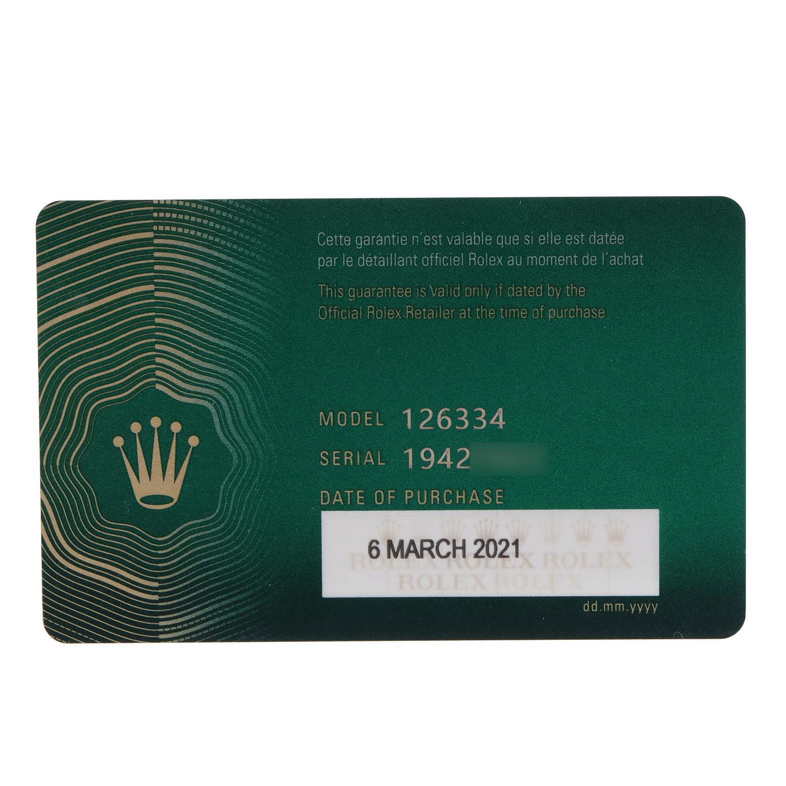 This image shows the official green warranty card of the Rolex Datejust 41 126334 Men
s Stainless Steel White Dial 126334 Men
s Stainless Steel White Dial model, with model, serial number, and purchase date.