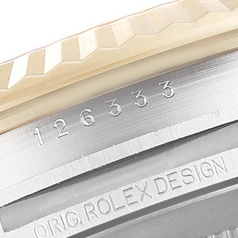 This image shows a close-up of the case and bezel of a Rolex Datejust 41 126333 Men's Steel and Gold (two tone) Black Dial 126333 Men's Steel and Gold (two tone) Black Dial watch, featuring the model number and "ORIG ROLEX DESIGN" engraving.