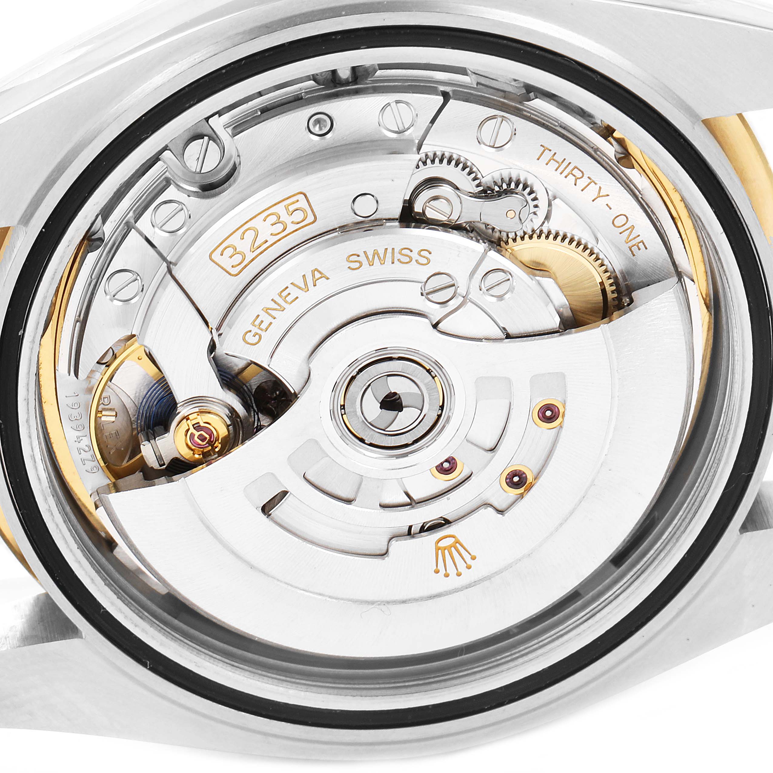 The image shows the inner mechanics of the back side of a Rolex Datejust 41 126303 Men
s Steel and Gold (two tone) Mother of Pearl Dial 126303 Men
s Steel and Gold (two tone) Mother of Pearl Dial watch, focusing on the movement and rotor.