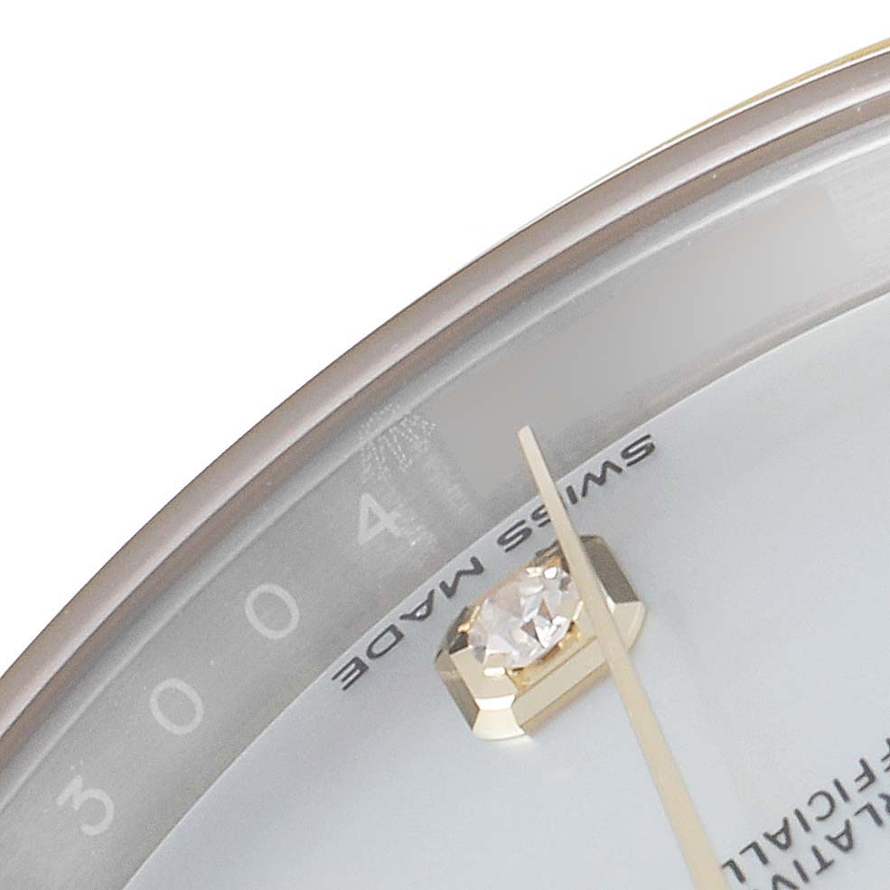 This image shows a close-up of the dial edge and diamond marker of a Rolex Datejust 41 126303 Men
s Steel and Gold (two tone) Mother of Pearl Dial 126303 Men
s Steel and Gold (two tone) Mother of Pearl Dial watch.