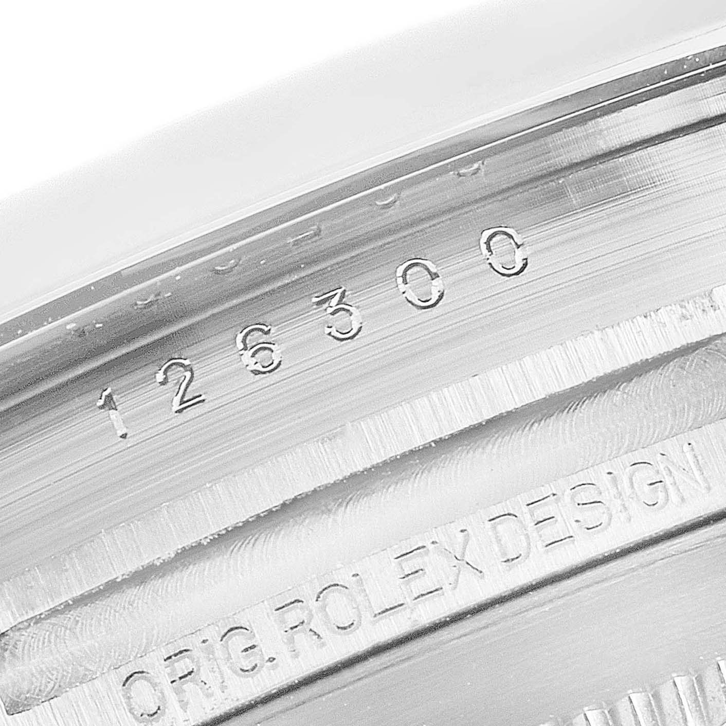 This close-up image shows the Rolex Datejust 41 126300 Men's Stainless Steel White Dial 126300 Men's Stainless Steel White Dial model number and "ORIG. ROLEX DESIGN" engraving.