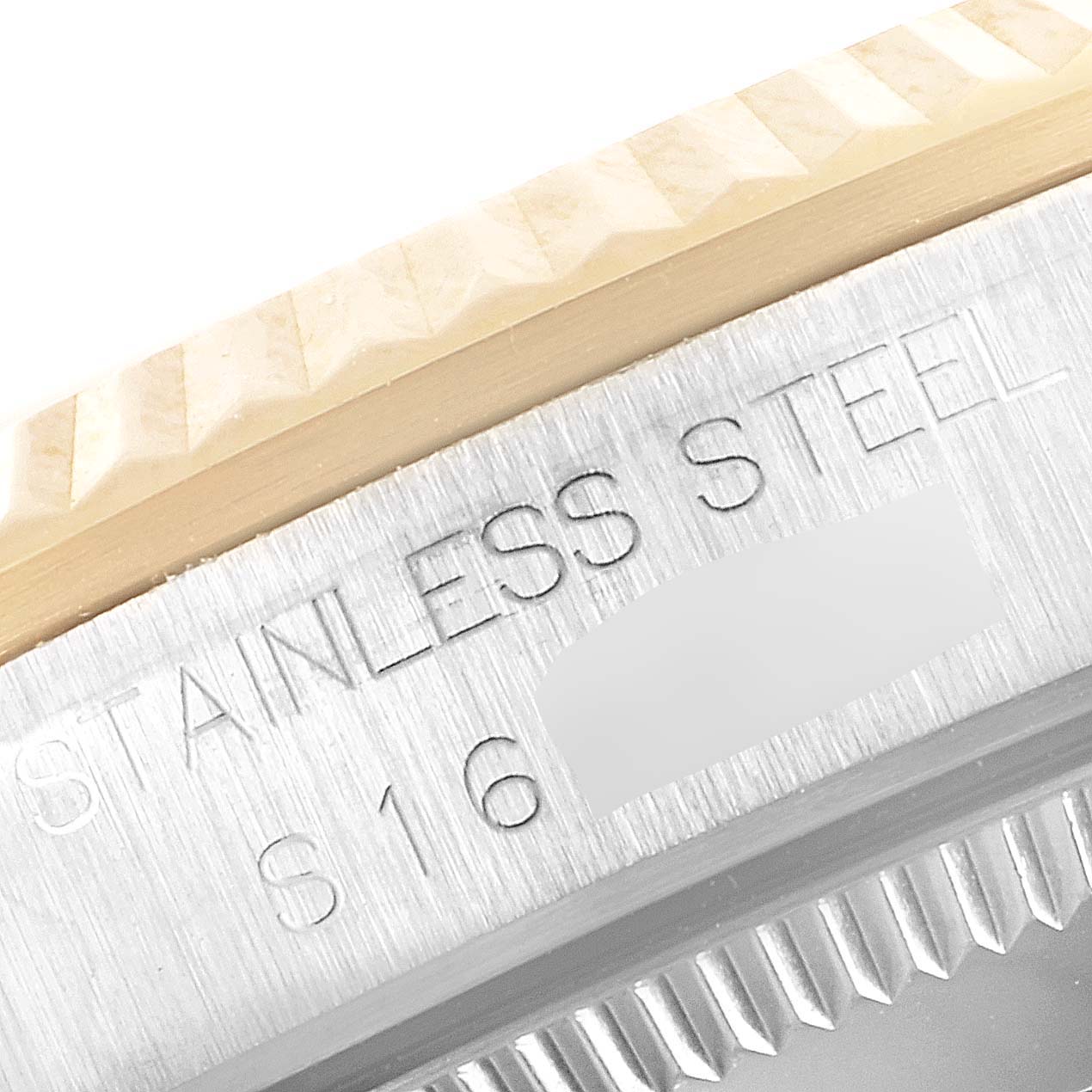 This image shows a close-up of the edge and engraved details on the case back of a Rolex Datejust 68273 Women's Stainless Steel Champagne Dial 68273 Women's Stainless Steel Champagne Dial watch.