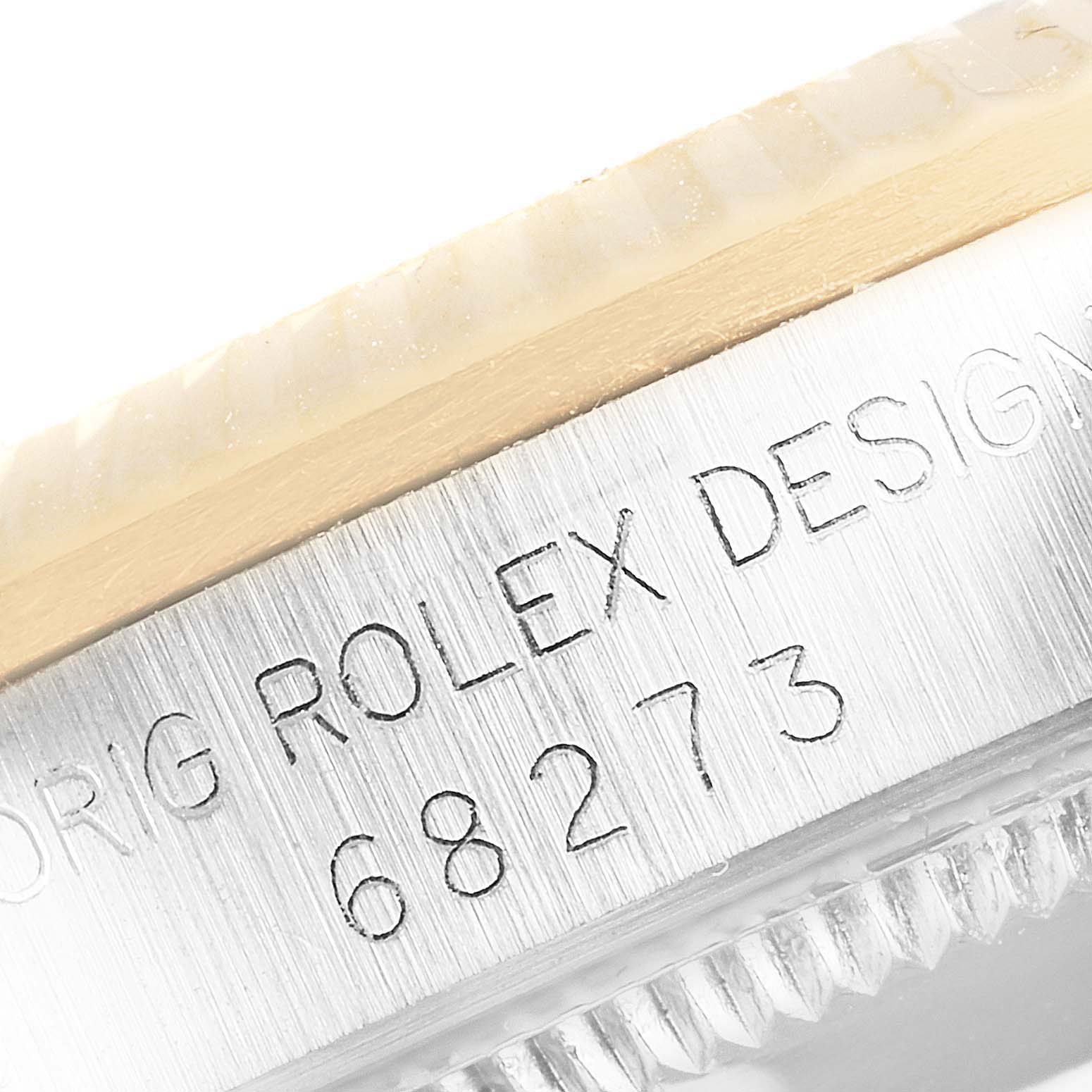 This image shows a close-up of the side engraving on a Rolex Datejust 68273 Women's Stainless Steel Champagne Dial 68273 Women's Stainless Steel Champagne Dial model, highlighting the model number and the "ROLEX DESIGN" text.