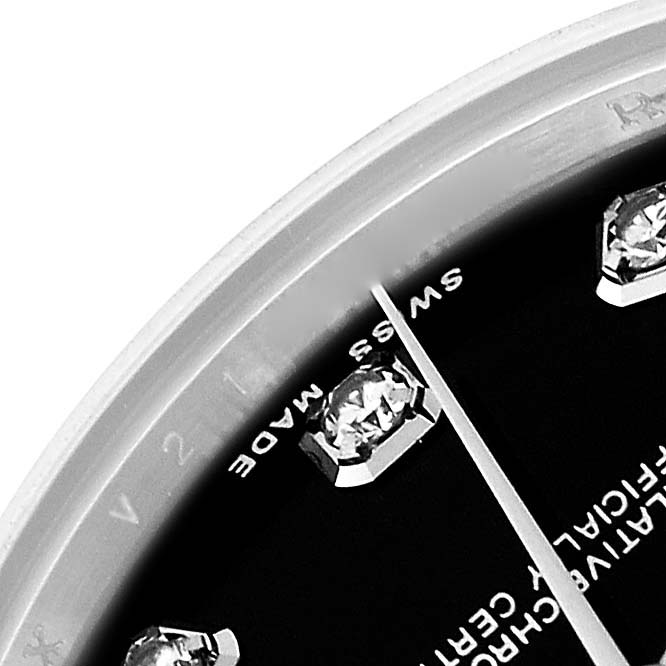 This image shows a close-up of the dial and diamond hour markers on a Rolex Mid-Size 178274 Women's Stainless Steel Black Dial 178274 Women's Stainless Steel Black Dial watch from a top-down angle.