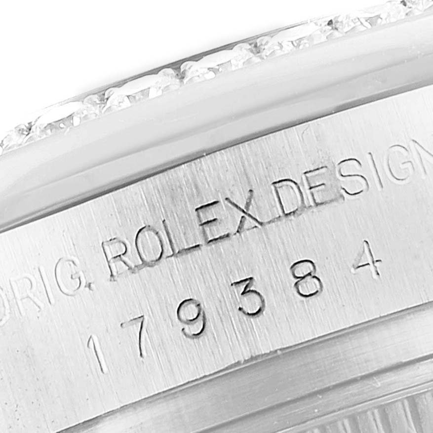 This image shows a close-up of the mid-size Rolex model 179384 watch case, highlighting its engraved model number and bezel.