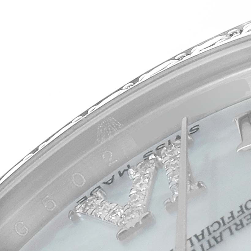 This image shows a close-up of the dial and part of the bezel of a Rolex Mid-Size 178384 Women's Stainless Steel Mother of Pearl Dial 178384 Women's Stainless Steel Mother of Pearl Dial watch.