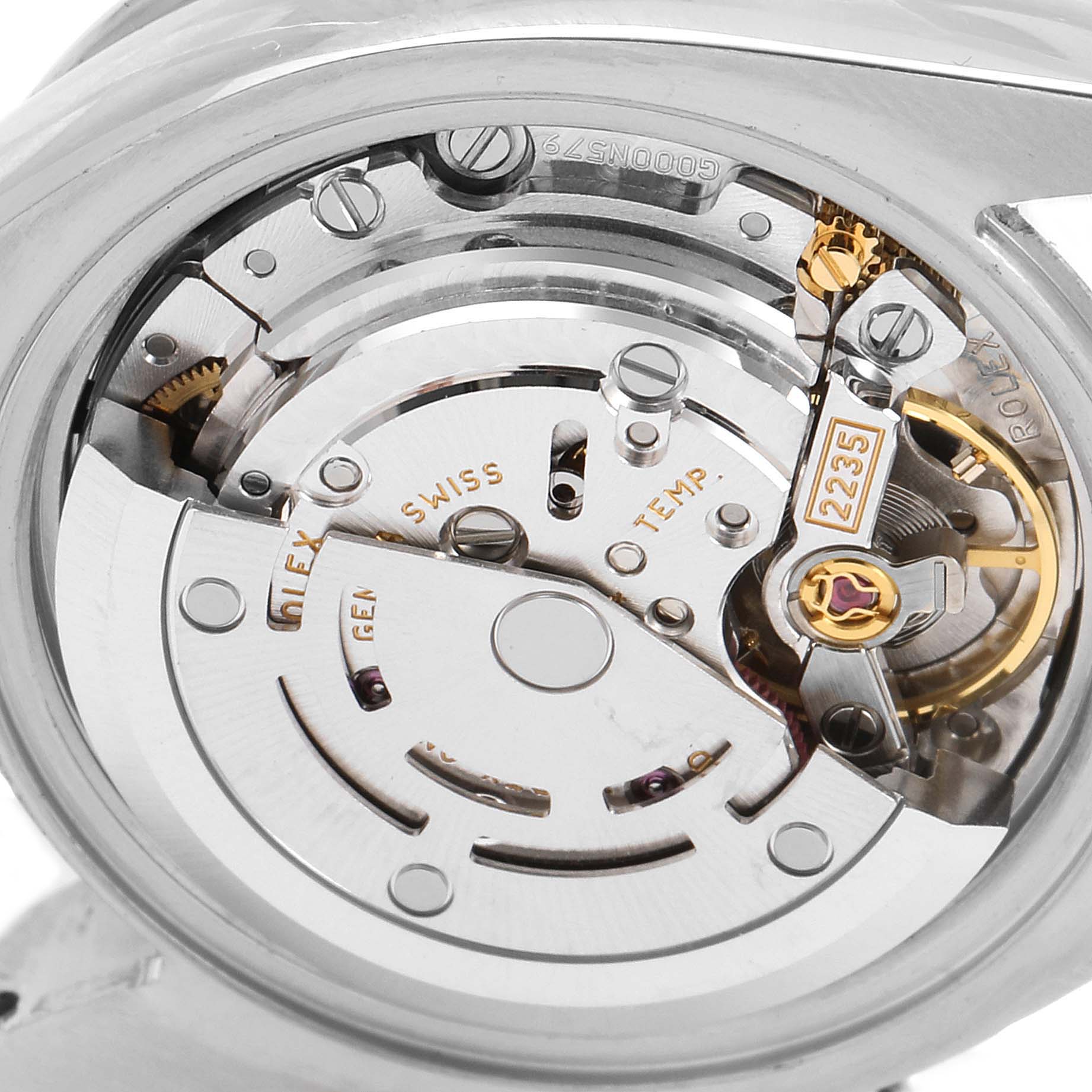 The image shows the internal mechanical movement of a Rolex Datejust 179384 Women
s Stainless Steel Pink Dial 179384 Women
s Stainless Steel Pink Dial, including gears and the balance wheel, viewed from the back.