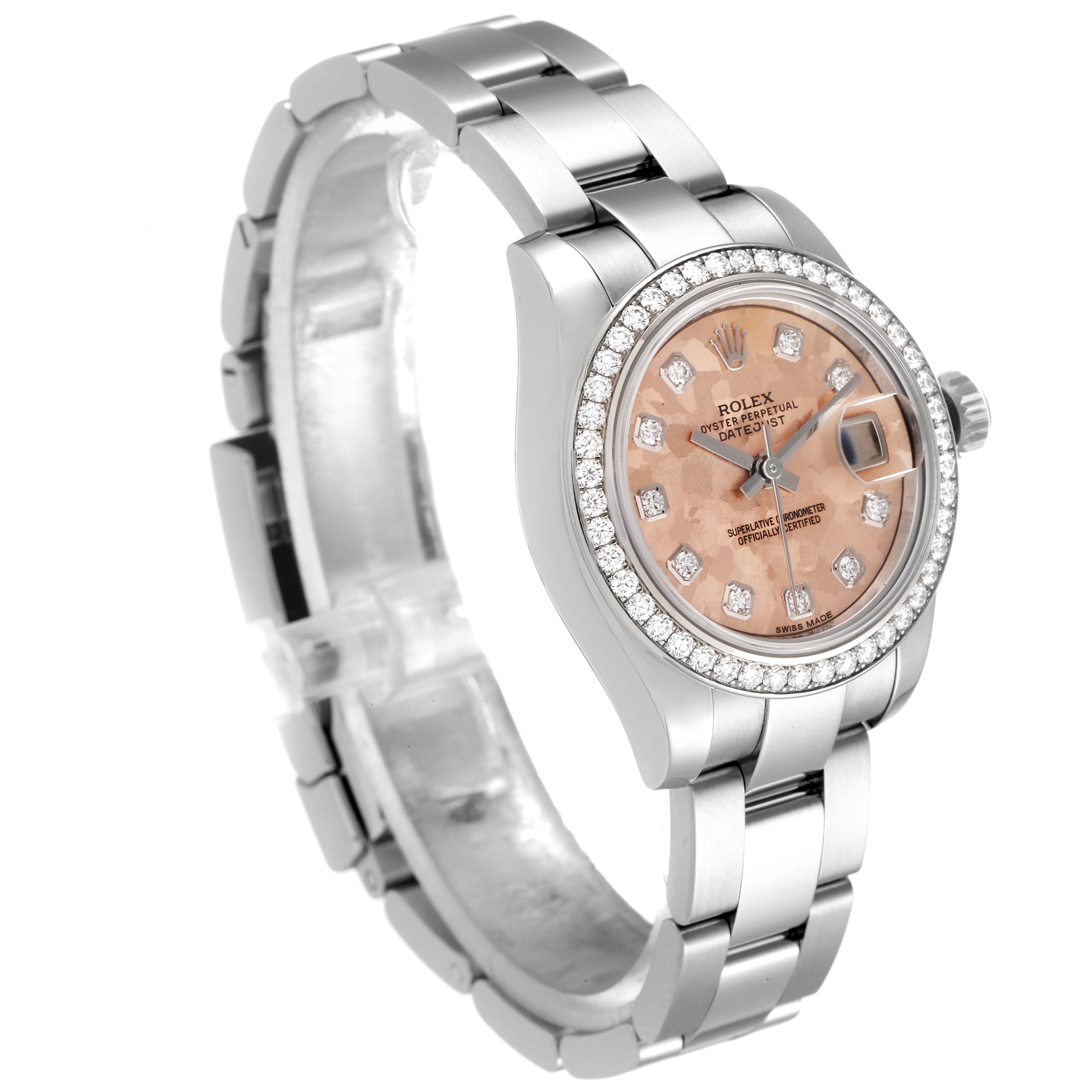 The Rolex Datejust 179384 Women
s Stainless Steel Pink Dial 179384 Women
s Stainless Steel Pink Dial watch is shown at a three-quarter angle, displaying its bezel, dial, bracelet, and part of the clasp.