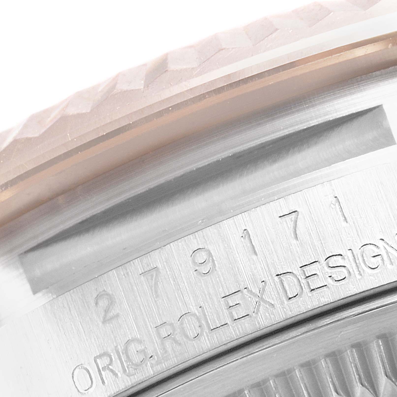 This close-up image shows a portion of the bezel and caseback edge of a Rolex Datejust 279171 Women's Steel and Gold (two tone) Brown Dial 279171 Women's Steel and Gold (two tone) Brown Dial watch, highlighting the engraved details.