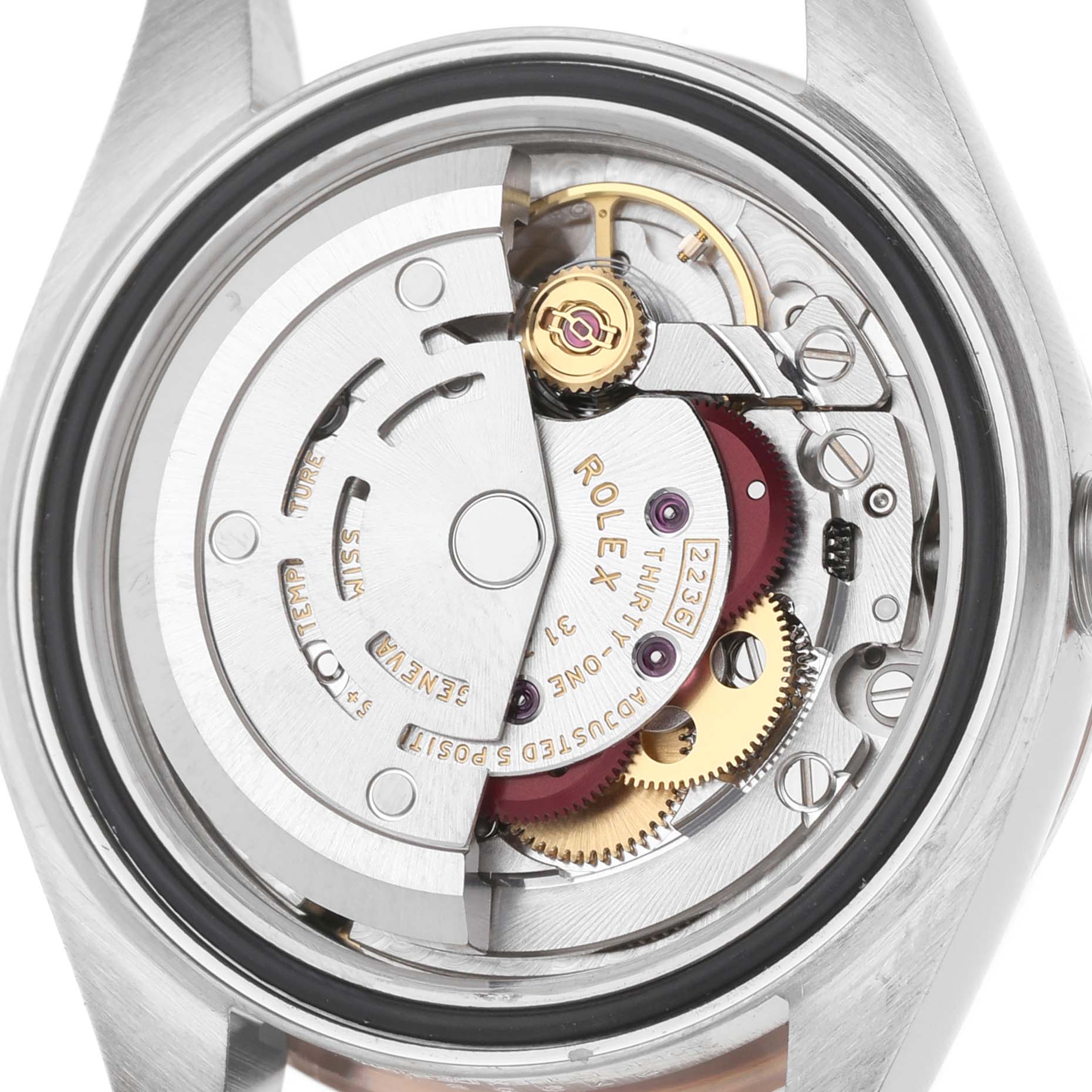 The image shows the movement of a Rolex Datejust 279381 Women's Steel and Gold (two tone) Purple Dial watch viewed from the back, revealing gears and the rotor.