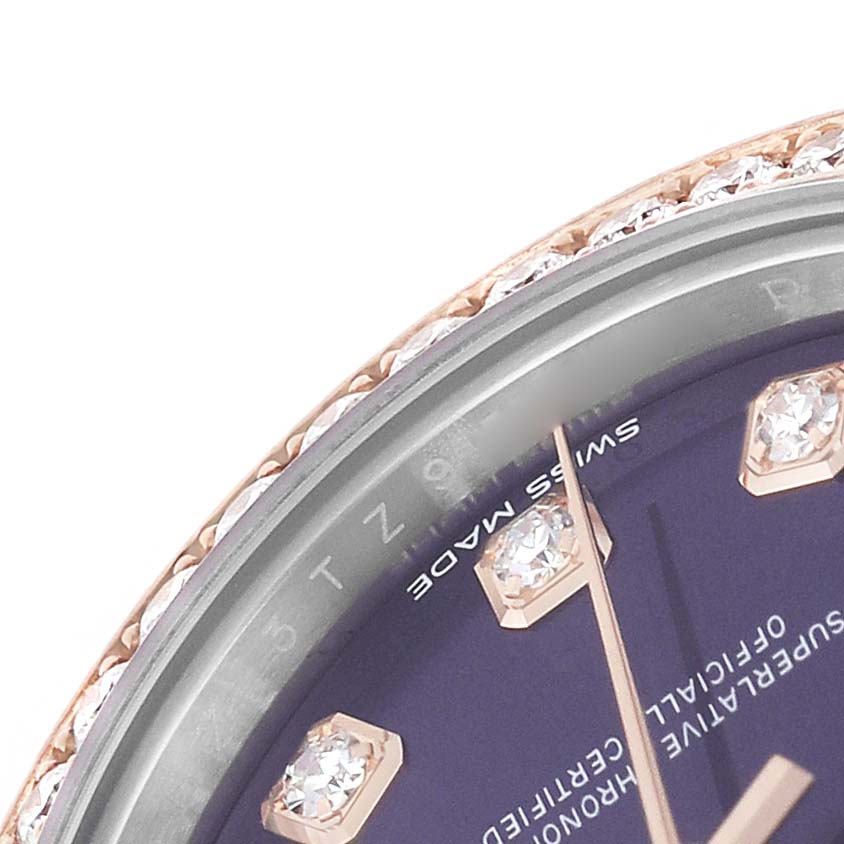 The image shows a close-up of the bezel, dial, and diamond markers of a Rolex Datejust 279381 Women's Steel and Gold (two tone) Purple Dial watch.