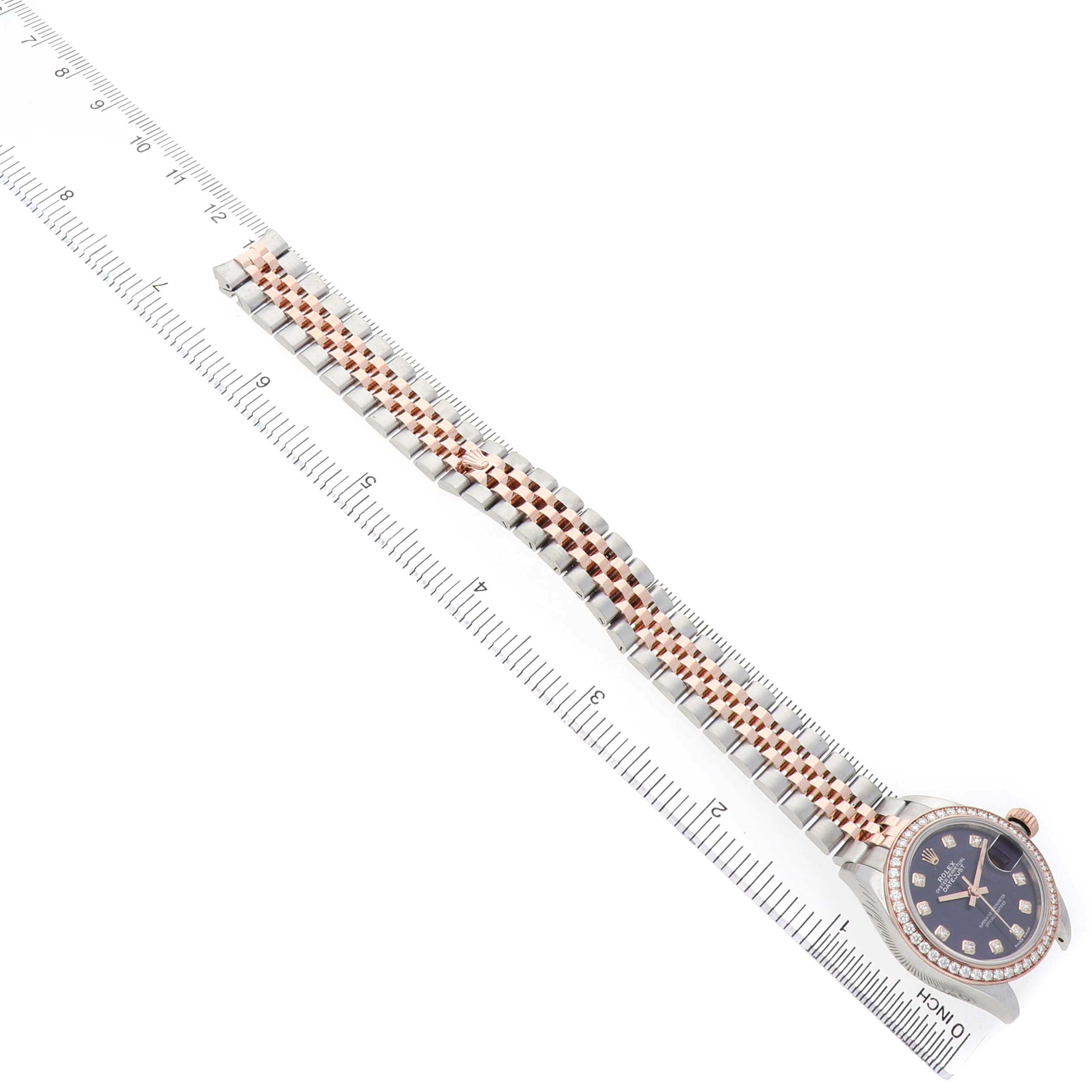 The Rolex Datejust 279381 Women's Steel and Gold (two tone) Purple Dial watch is displayed from a top angle, showcasing the face and two-tone bracelet.