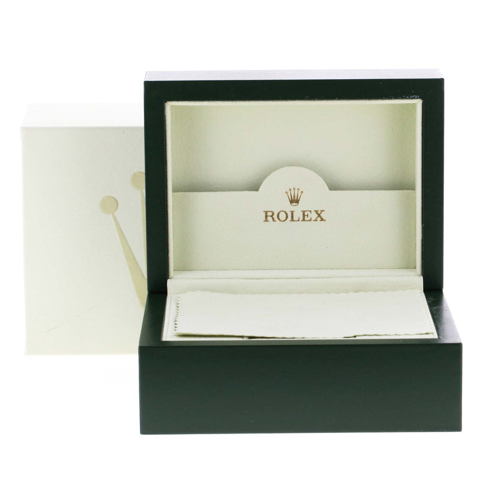 This image shows an open Rolex Datejust 116234 Men's Stainless Steel Silver Dial 116234 Men's Stainless Steel Silver Dial watch box, including its inner compartment and cleaning cloth, from a front angle.