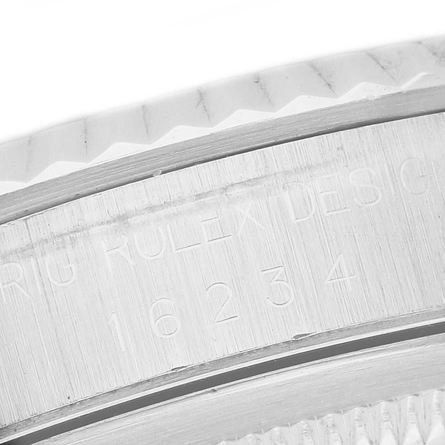 The image shows a close-up of the case side engraving and bezel details of a Rolex Datejust 16234 Men's Stainless Steel Silver Dial watch.