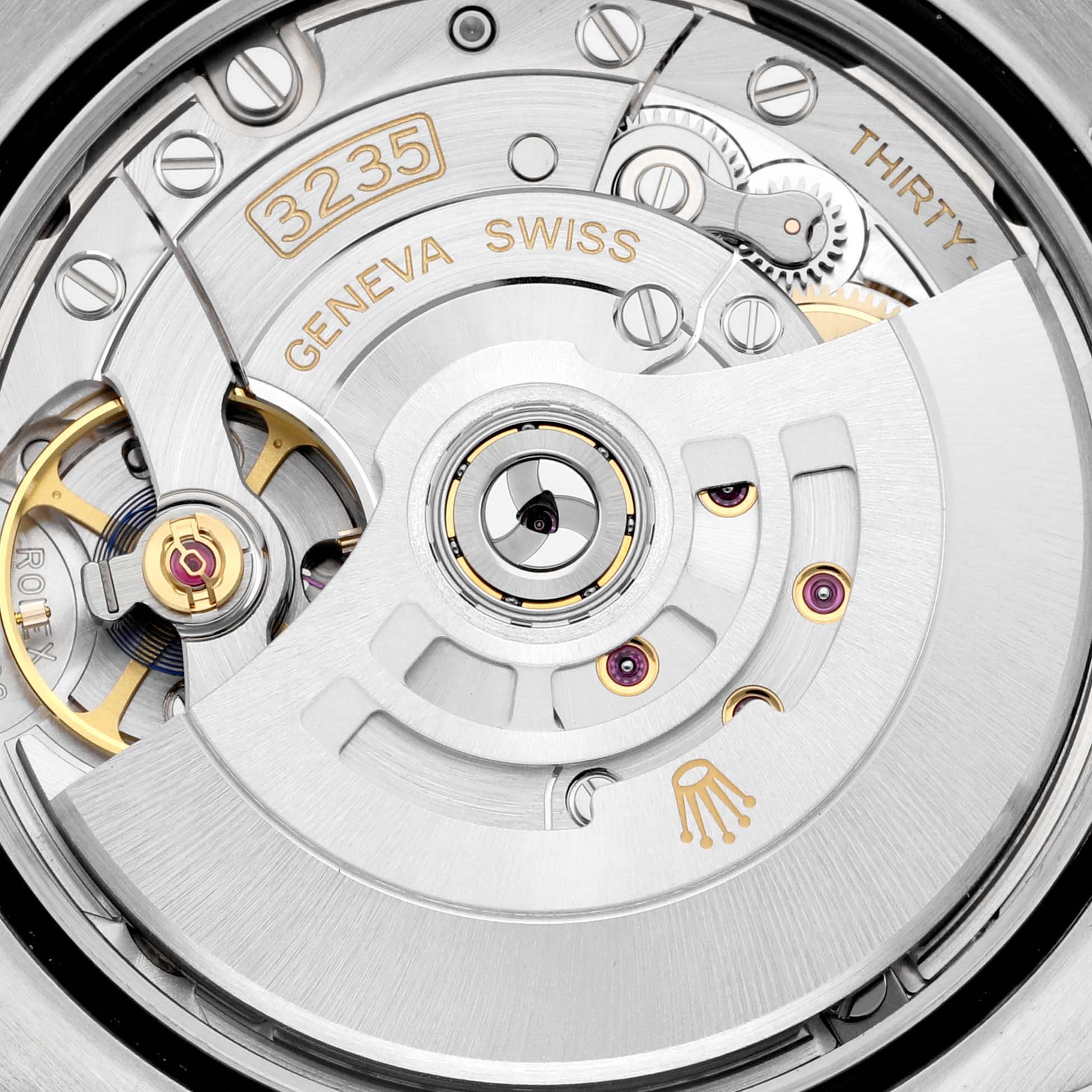This is a close-up view of the movement of a Rolex Datejust 126203 Men's Steel and Gold (two tone) Champagne Dial 126203 Men's Steel and Gold (two tone) Champagne Dial watch, showing its gears and intricate mechanisms.