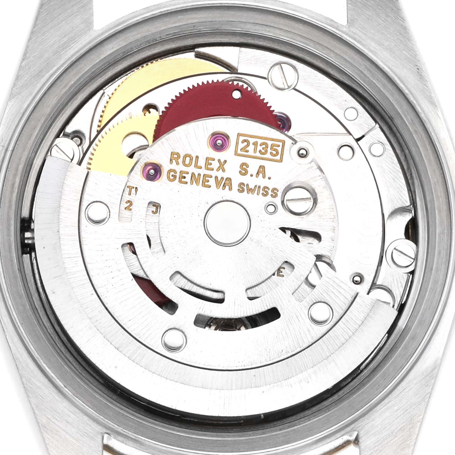 The image shows the movement mechanism of a Rolex Datejust 69173 Women
s Steel and Gold (two tone) Champagne Dial 69173 Women
s Steel and Gold (two tone) Champagne Dial watch from a back view, revealing gears and inscriptions.