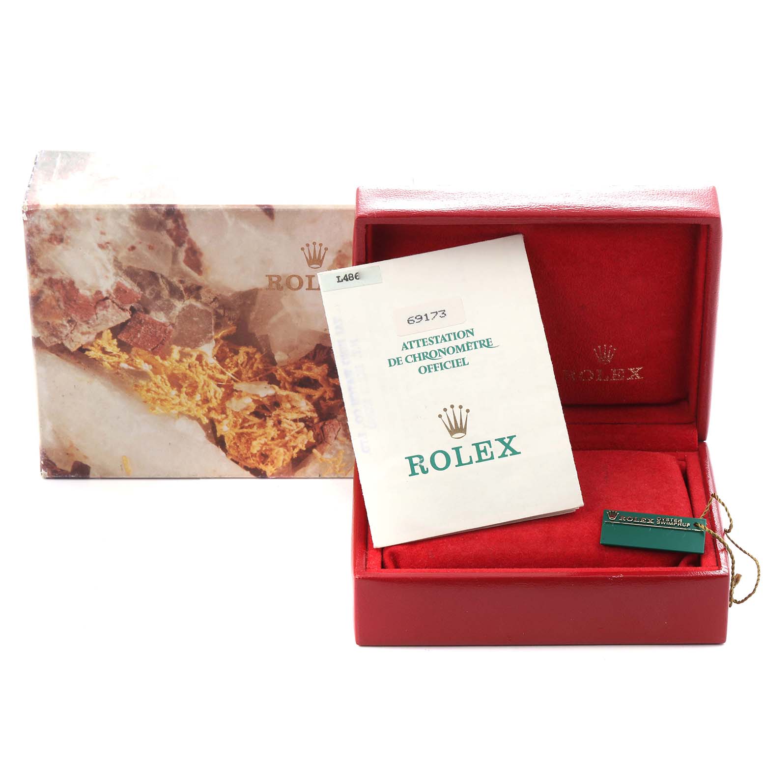 The image shows a Rolex Datejust 69173 Women
s Steel and Gold (two tone) Champagne Dial 69173 Women
s Steel and Gold (two tone) Champagne Dial box with papers and a tag, viewed from the front.