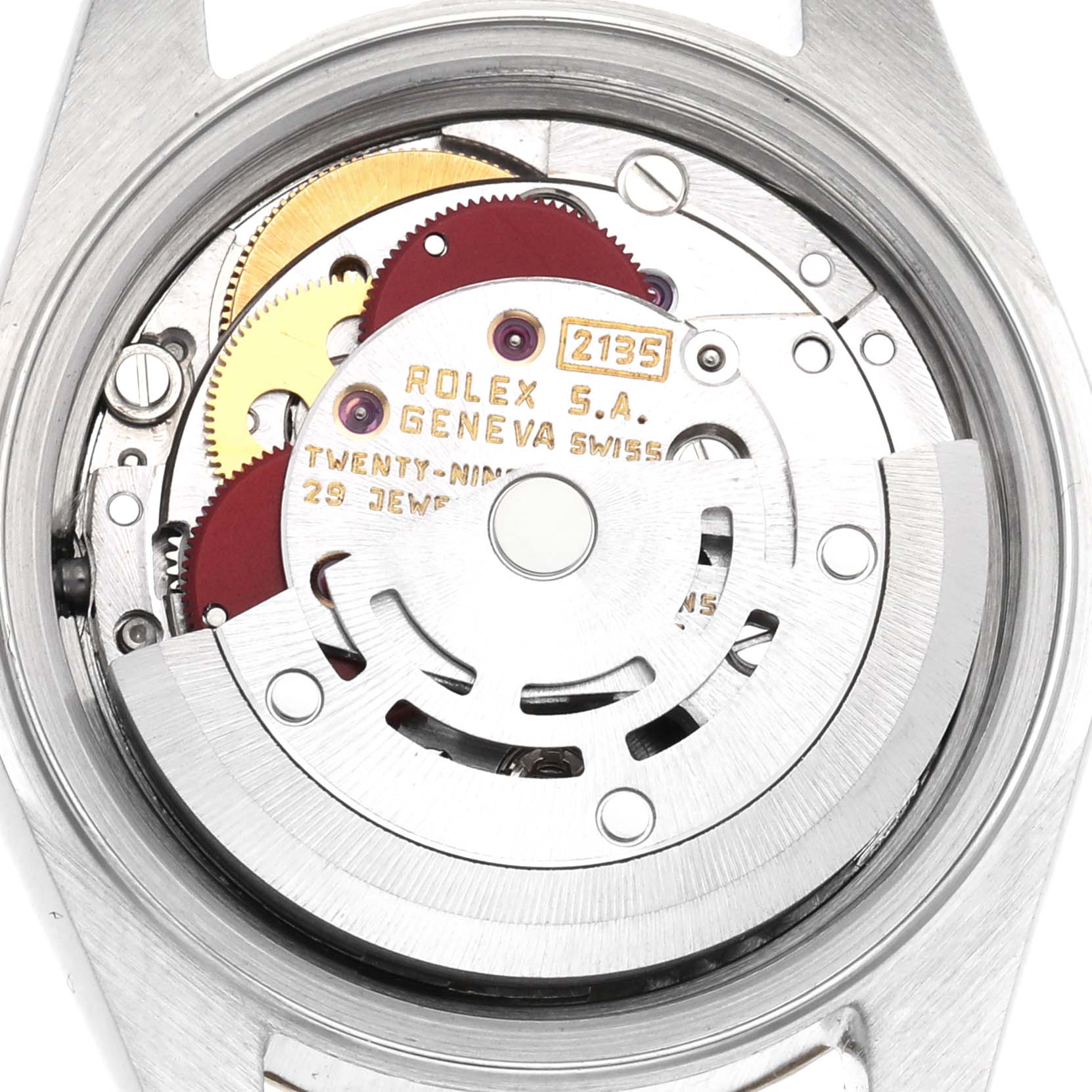 The image shows a top-down view of the movement inside a Rolex Datejust 69173 Women
s Steel and Gold (two tone) Champagne Dial 69173 Women
s Steel and Gold (two tone) Champagne Dial watch, revealing gears and inscriptions.