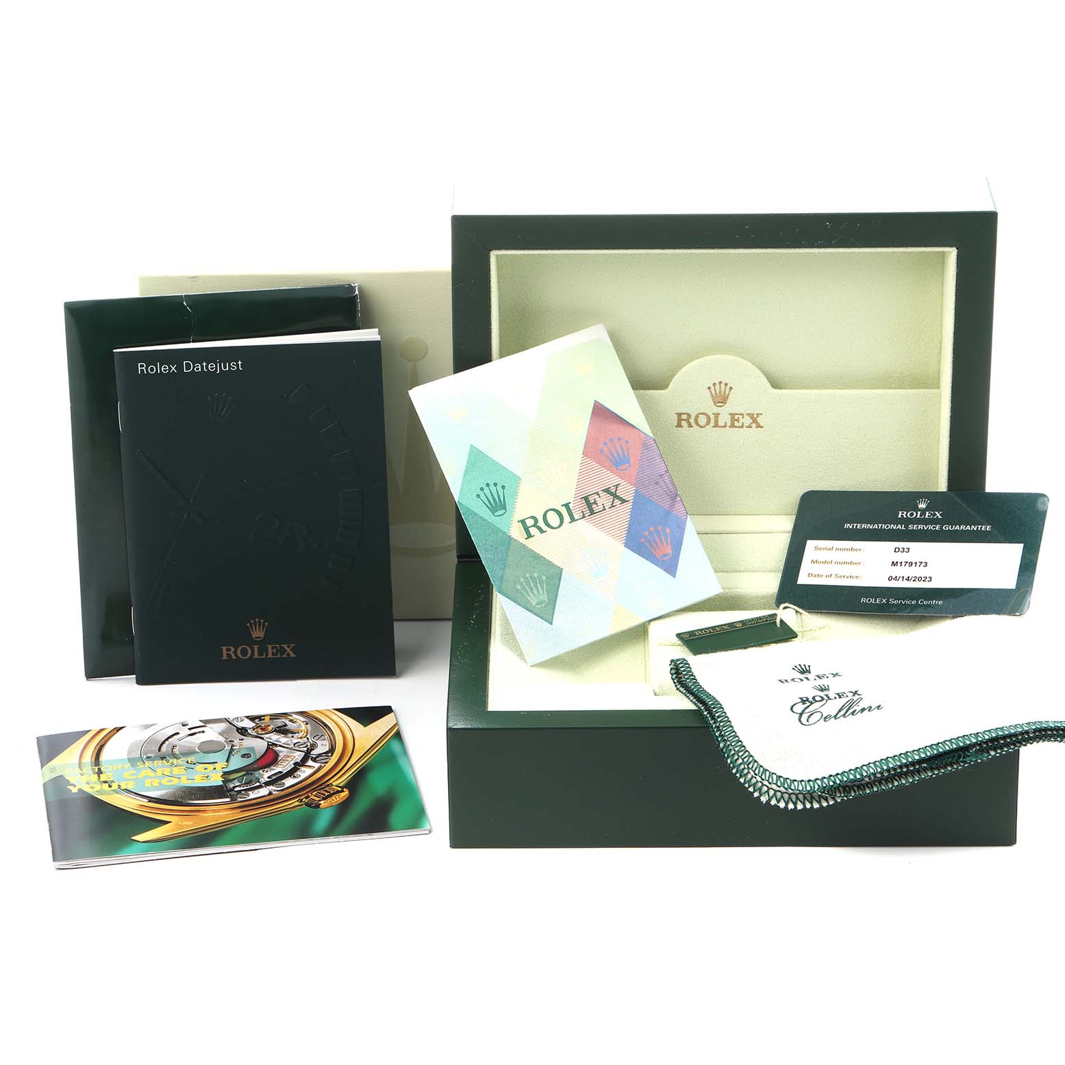 The image shows the packaging and accessories for a Rolex Datejust 179173 Women
s Steel and Gold (two tone) Black Dial 179173 Women
s Steel and Gold (two tone) Black Dial, including manuals, a cleaning cloth, and a warranty card.