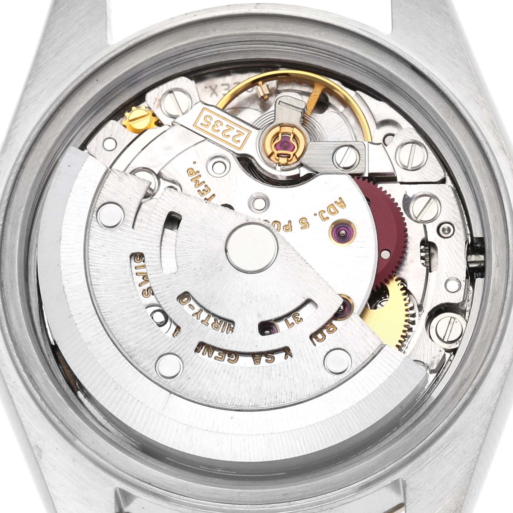 The image shows the movement of a Rolex Datejust 79173 Women
s Steel and Gold (two tone) Champagne Dial 79173 Women
s Steel and Gold (two tone) Champagne Dial watch, viewed from the back with visible gears and rotor.