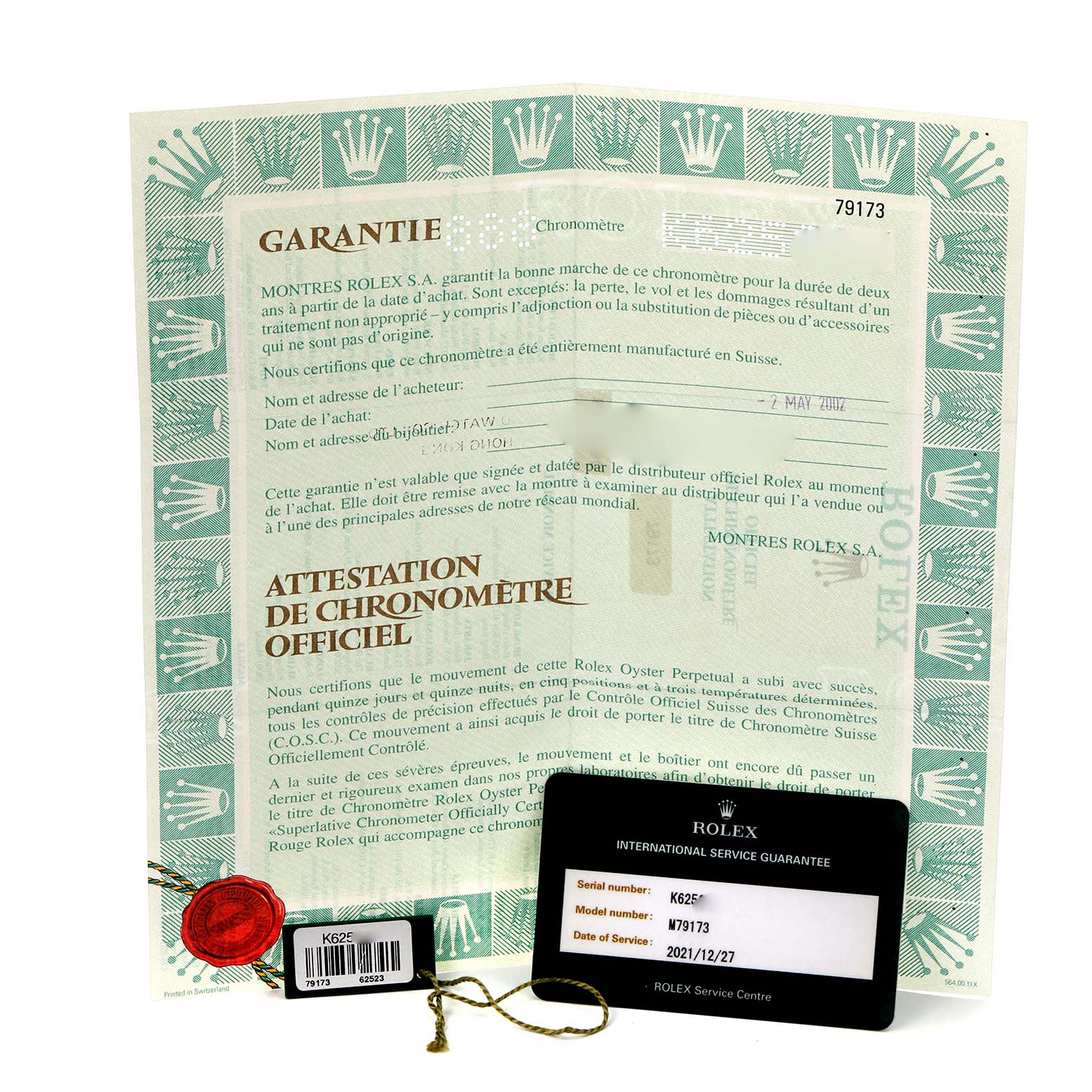 The image shows Rolex Datejust 79173 Women
s Steel and Gold (two tone) Black Dial 79173 Women
s Steel and Gold (two tone) Black Dial documentation and accessories, including a certificate, tag, and service guarantee card.