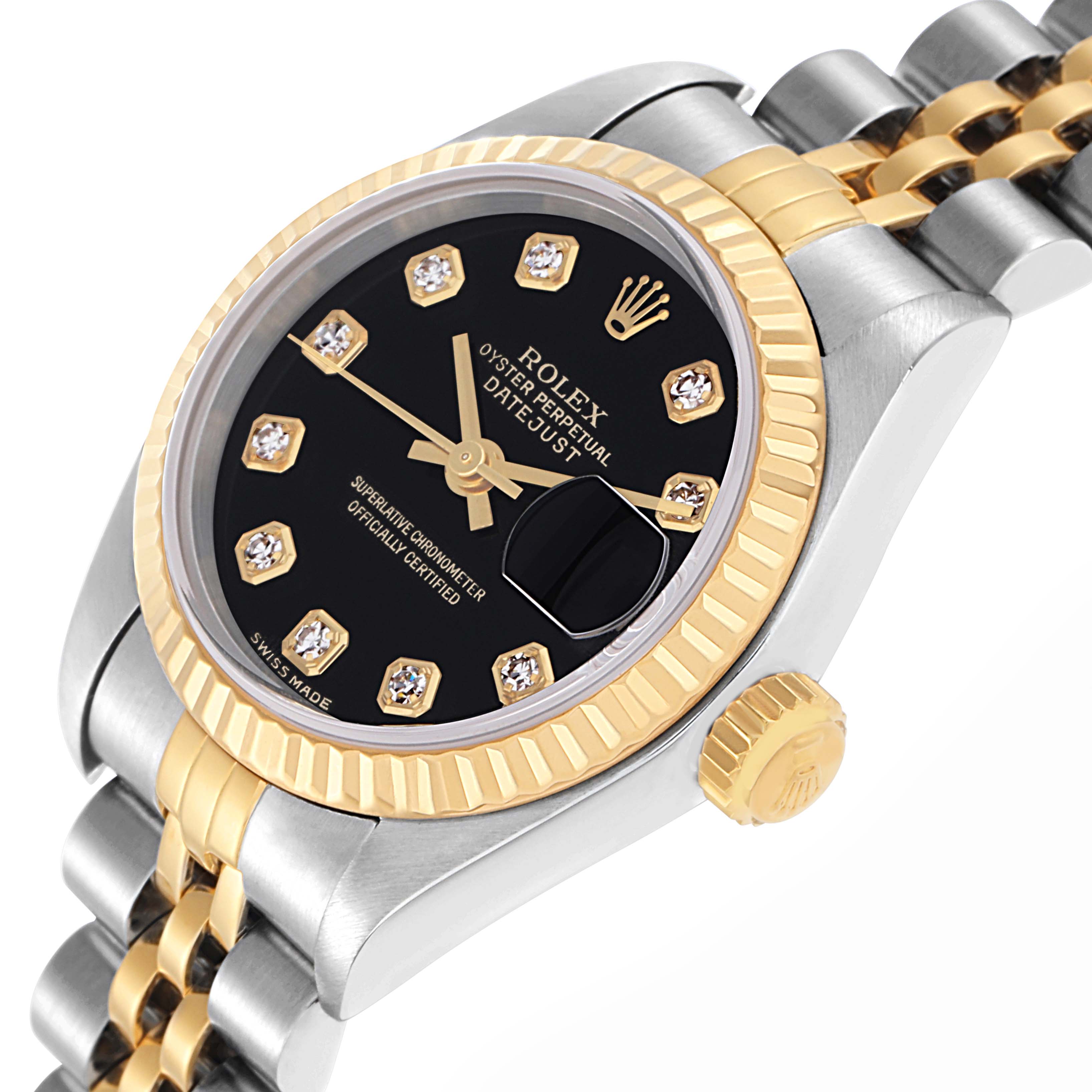The Rolex Datejust 79173 Women
s Steel and Gold (two tone) Black Dial 79173 Women
s Steel and Gold (two tone) Black Dial watch is shown at an angle highlighting its face, fluted bezel, crown, and two-tone bracelet.