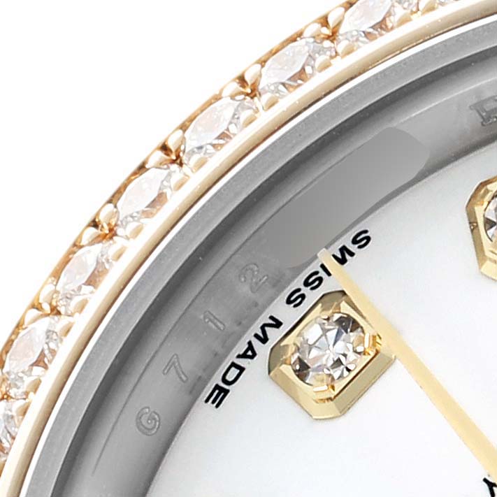 The image shows a close-up of the bezel, diamonds, and part of the dial of the Rolex Datejust 179383 Women's Steel and Gold (two tone) White Dial watch.