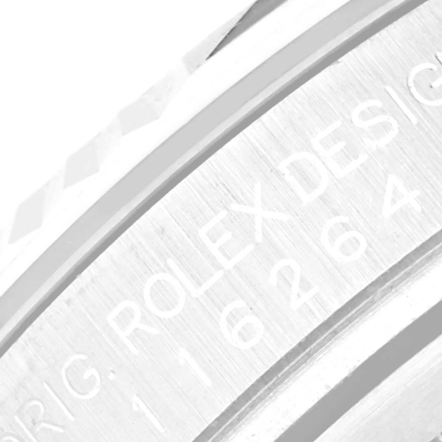 This close-up image shows the engraved serial number and branding on the bezel of a Rolex Turn-o-Graph 116264 Men's Stainless Steel Black Dial 116264 Men's Stainless Steel Black Dial watch.