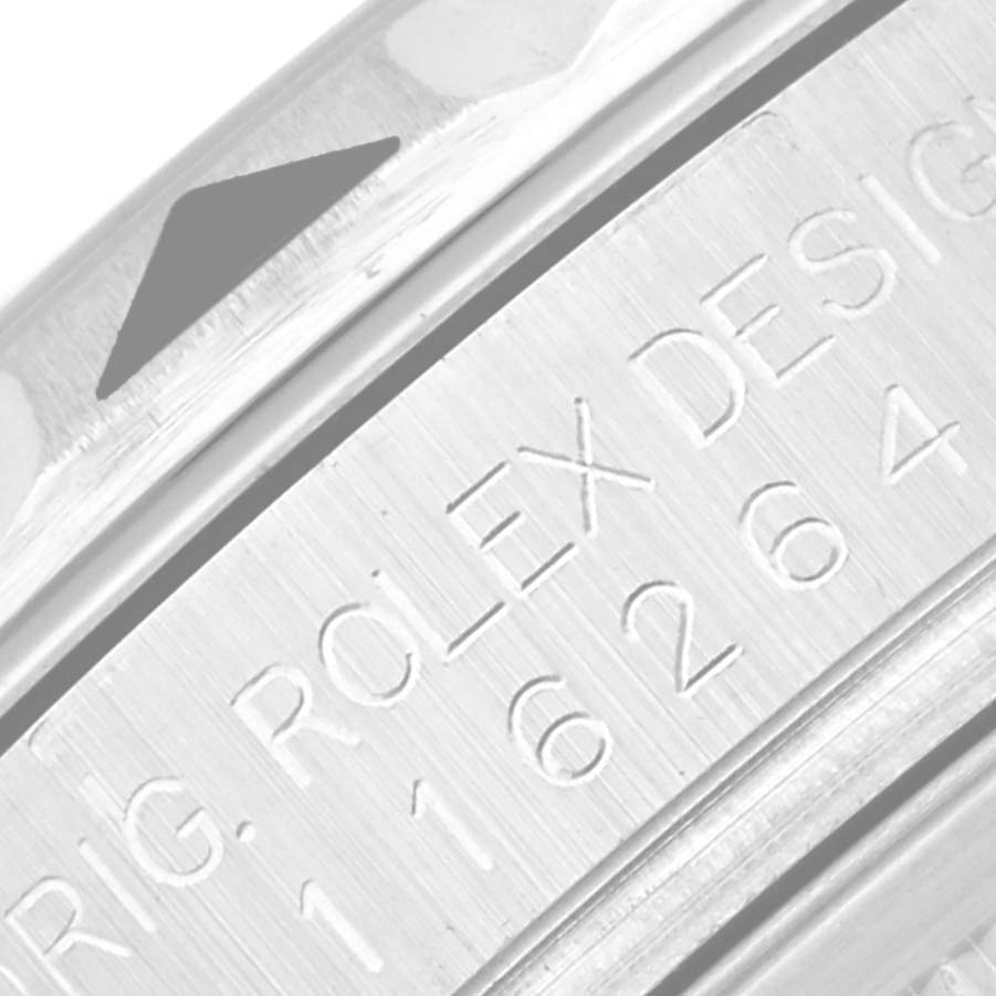 This image shows a close-up of the side engraving on a Rolex Datejust 116264 Men's Stainless Steel Blue Dial 116264 Men's Stainless Steel Blue Dial model watch case.