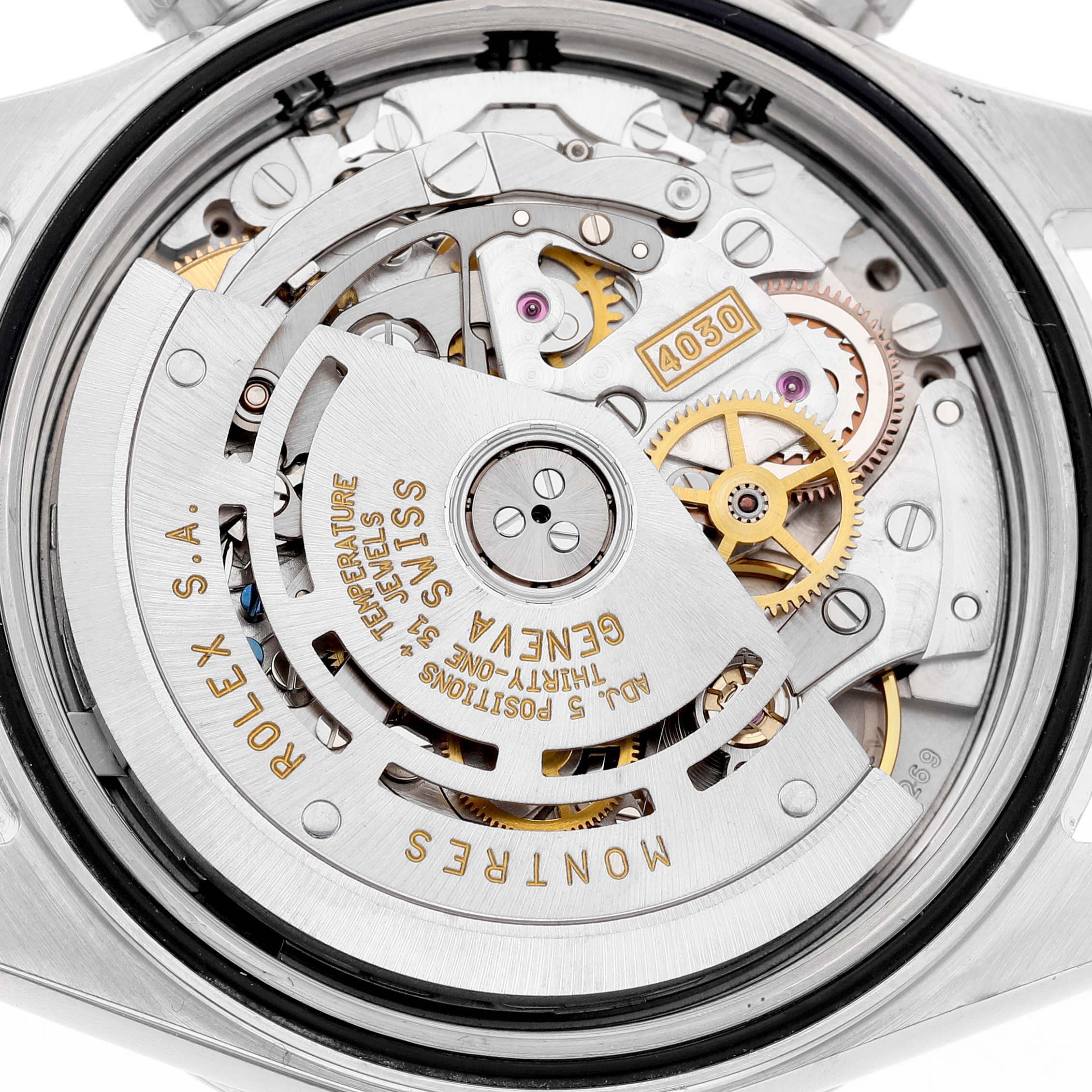 The image shows the Rolex Daytona 16520 Men's Stainless Steel White Dial's movement viewed from the back, highlighting the intricate gears and inscriptions.