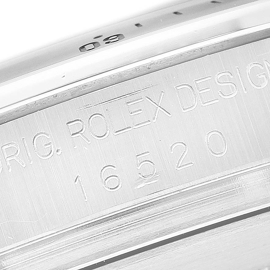 The image shows a close-up of the case edge, featuring the Rolex branding and model number "16520" of the Daytona watch.