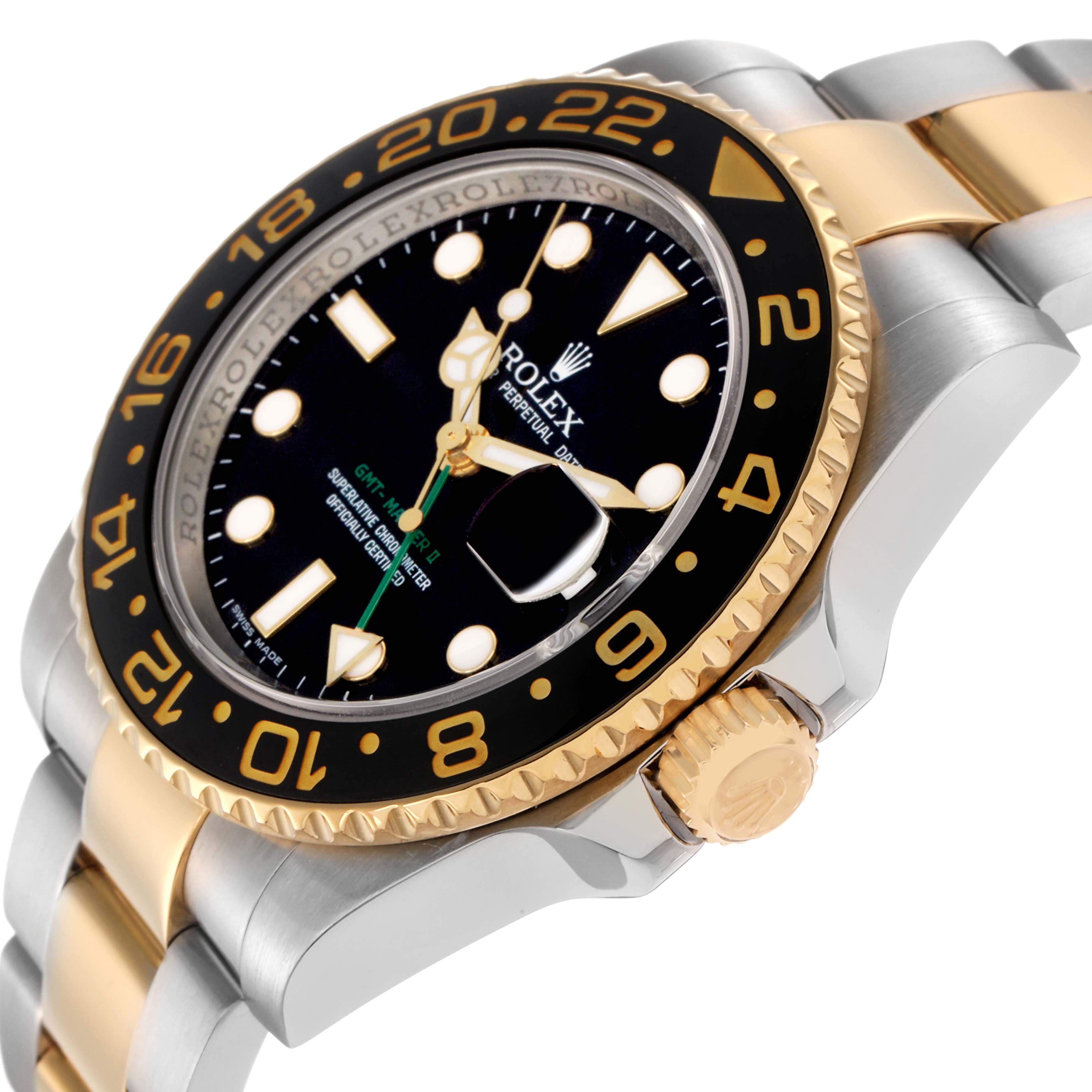 The image shows a tilted side view of the Rolex GMT-Master 116713 Men
s Steel and Gold (two tone) Black Dial 116713 Men
s Steel and Gold (two tone) Black Dial, highlighting the bezel, crown, and bracelet.